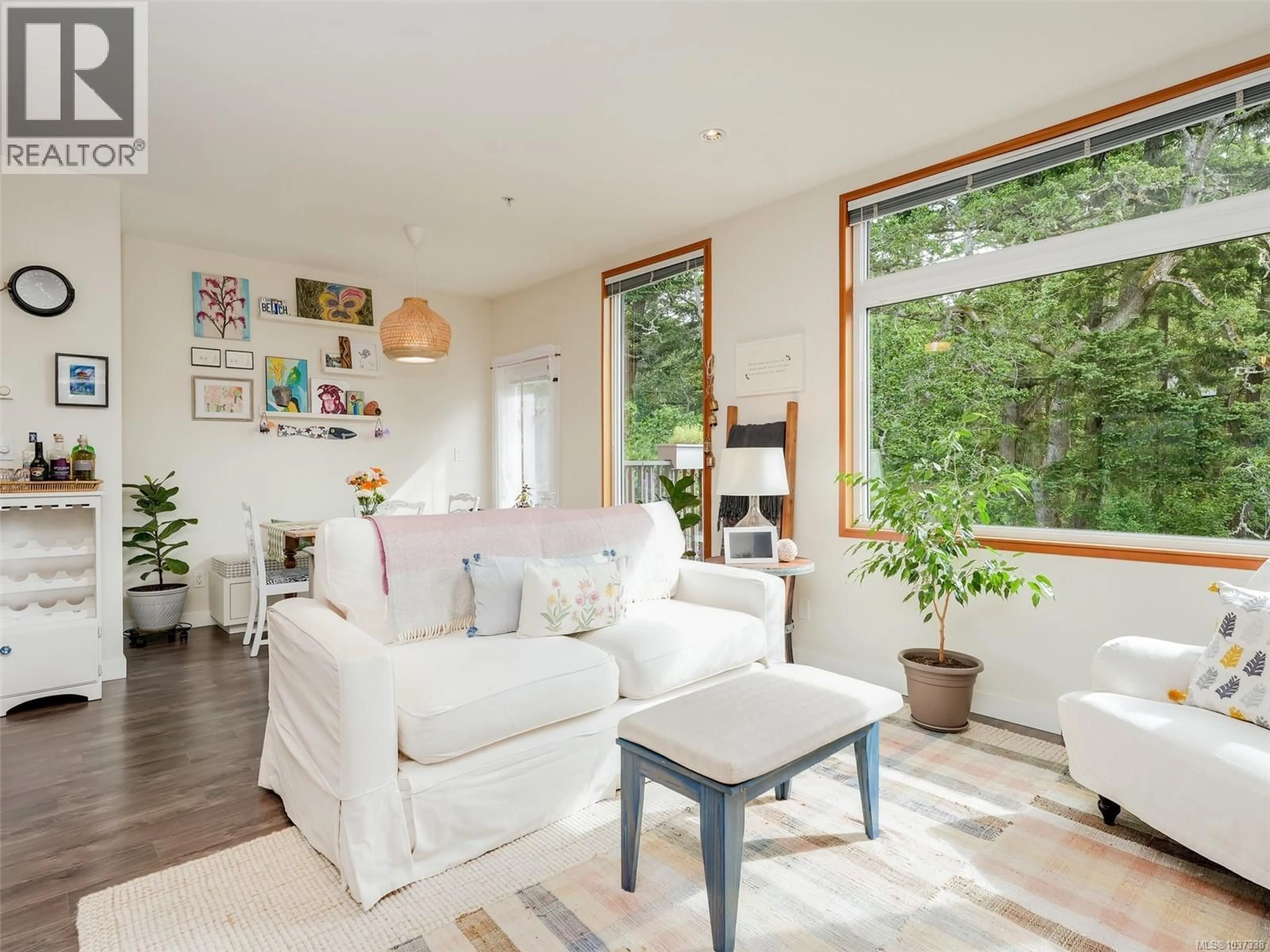 Living room with furniture, wood/laminate floor for 303 - 170 NURSERY HILL DRIVE, View Royal British Columbia V9B0P2