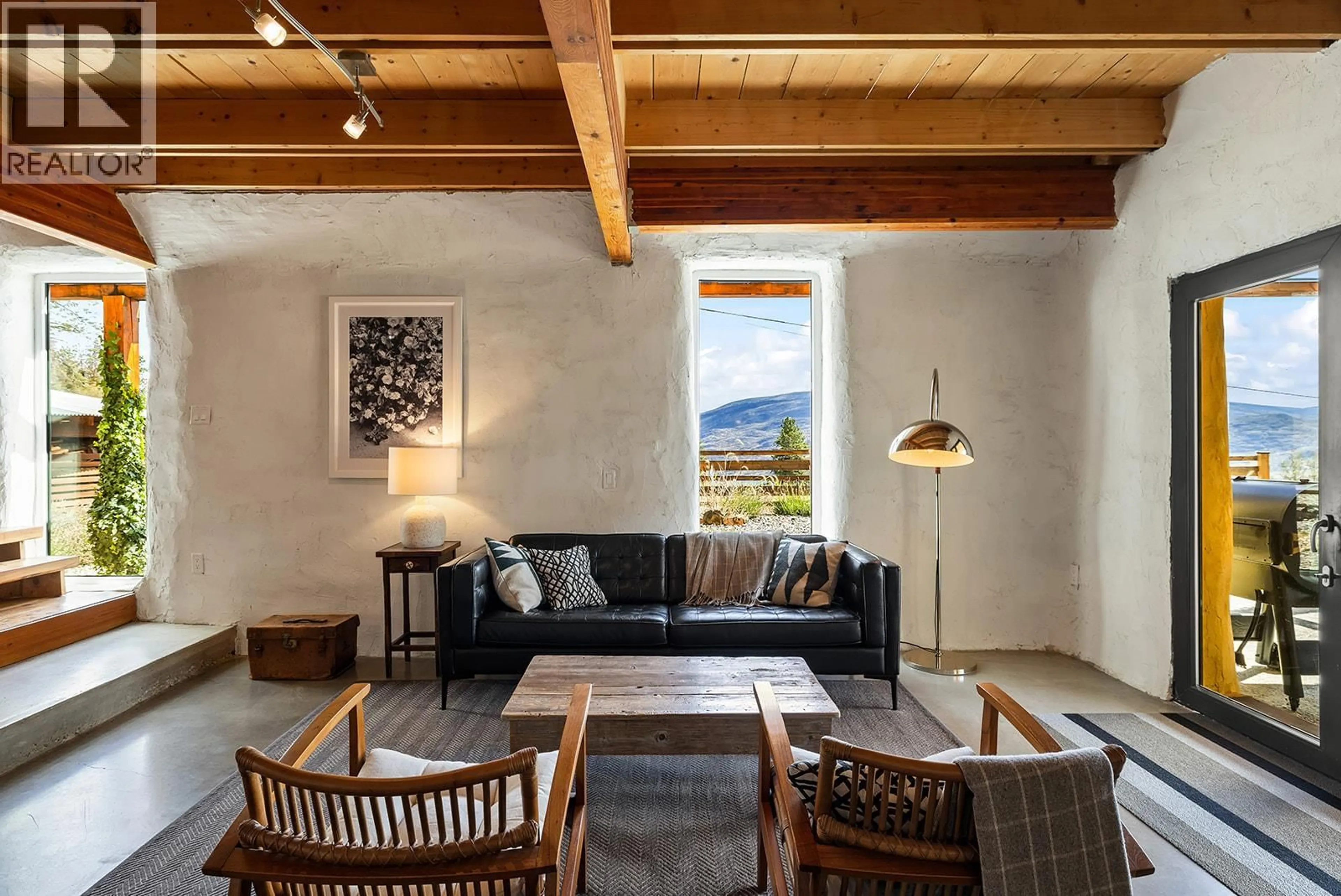 Living room with furniture, cement floor for 6226 SANDERSON AVENUE, Peachland British Columbia V0H1X8