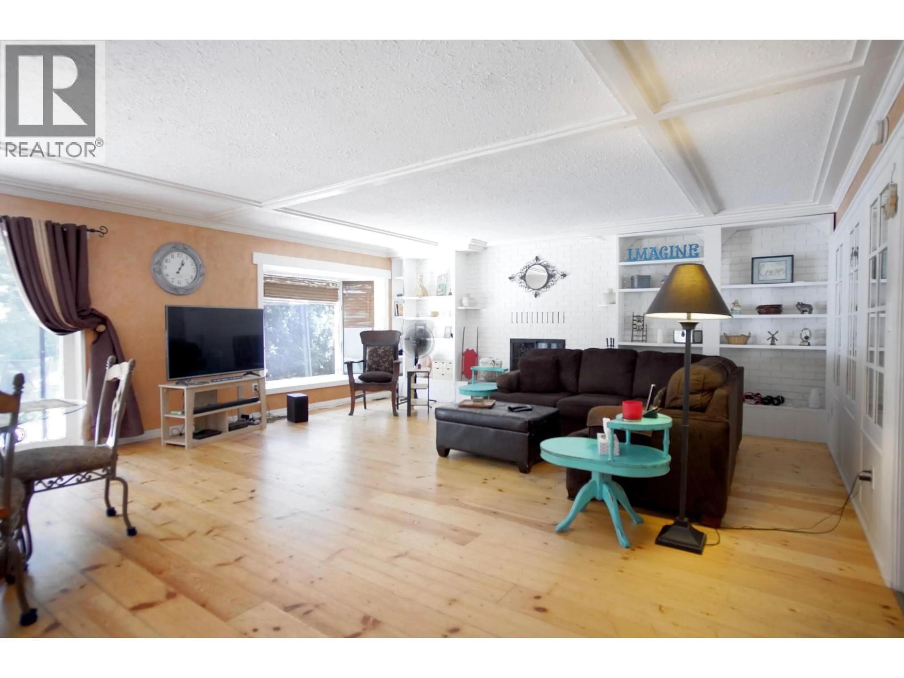 Living room with furniture, wood/laminate floor for 131 SALMON RIVER ROAD, Salmon Arm British Columbia V1E3E3
