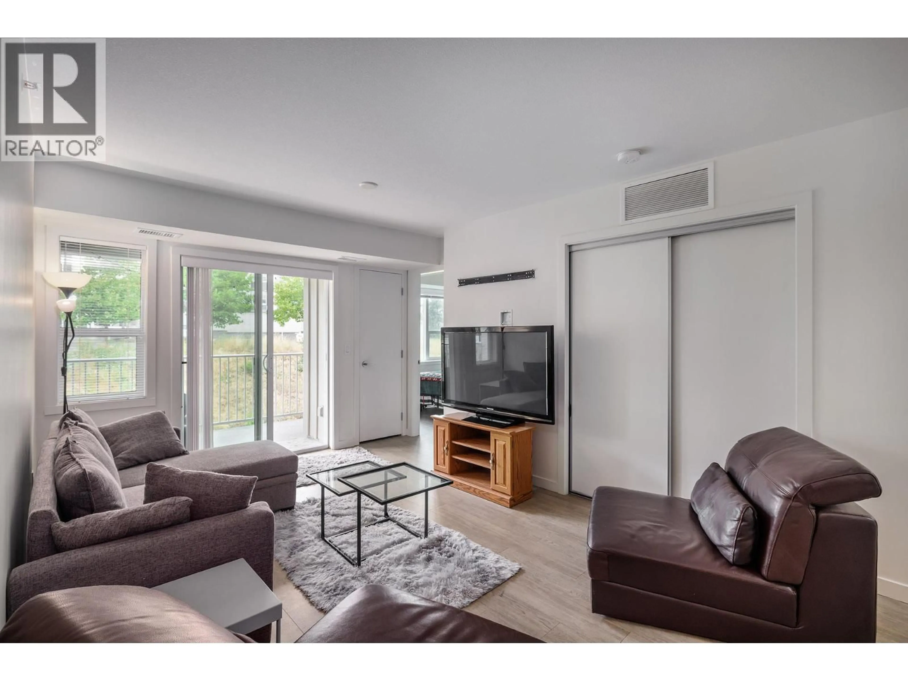 Living room with furniture, unknown for PH18 - 725 ACADEMY WAY, Kelowna British Columbia V1V3A4