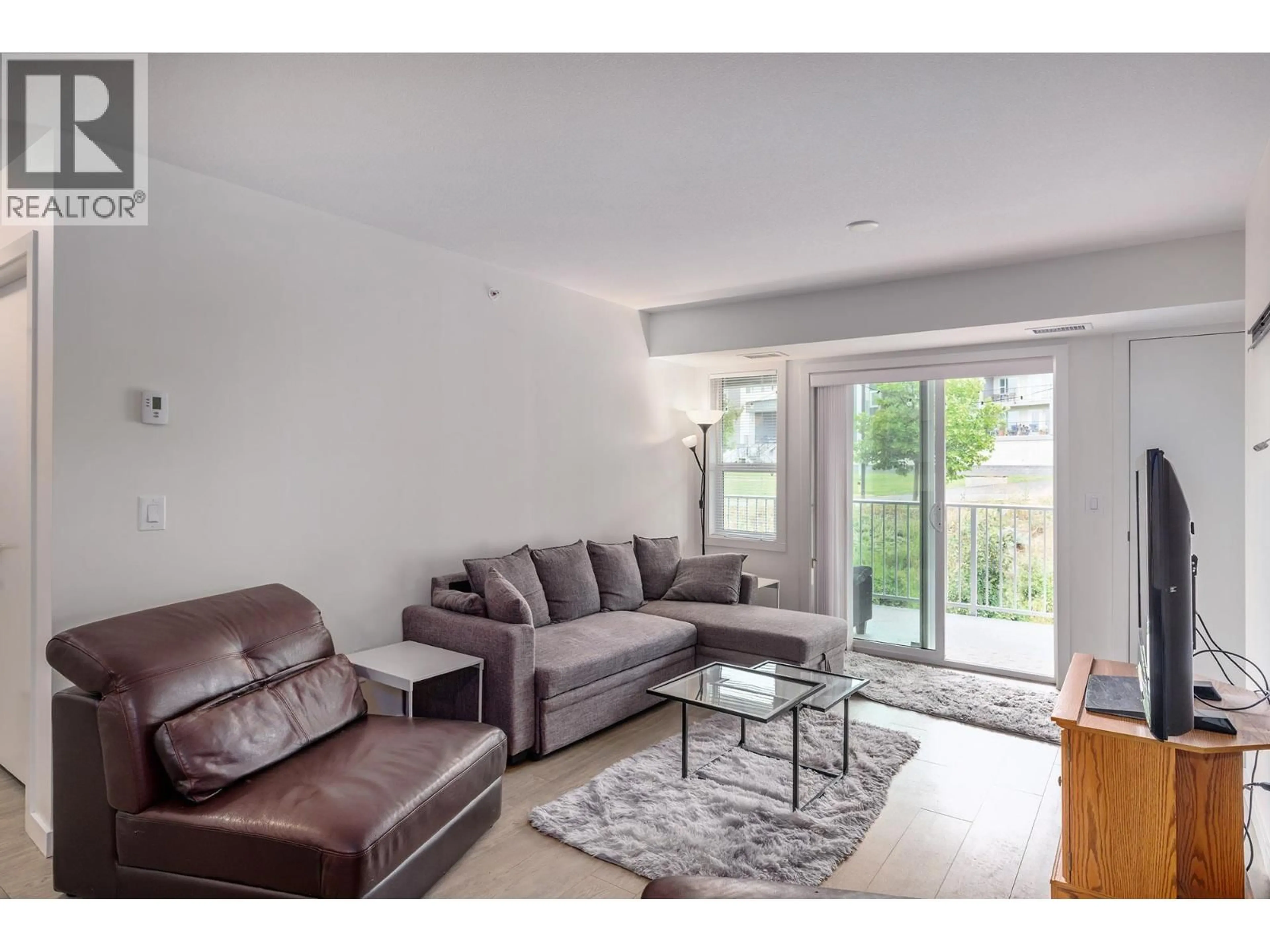 Living room with furniture, unknown for PH18 - 725 ACADEMY WAY, Kelowna British Columbia V1V3A4
