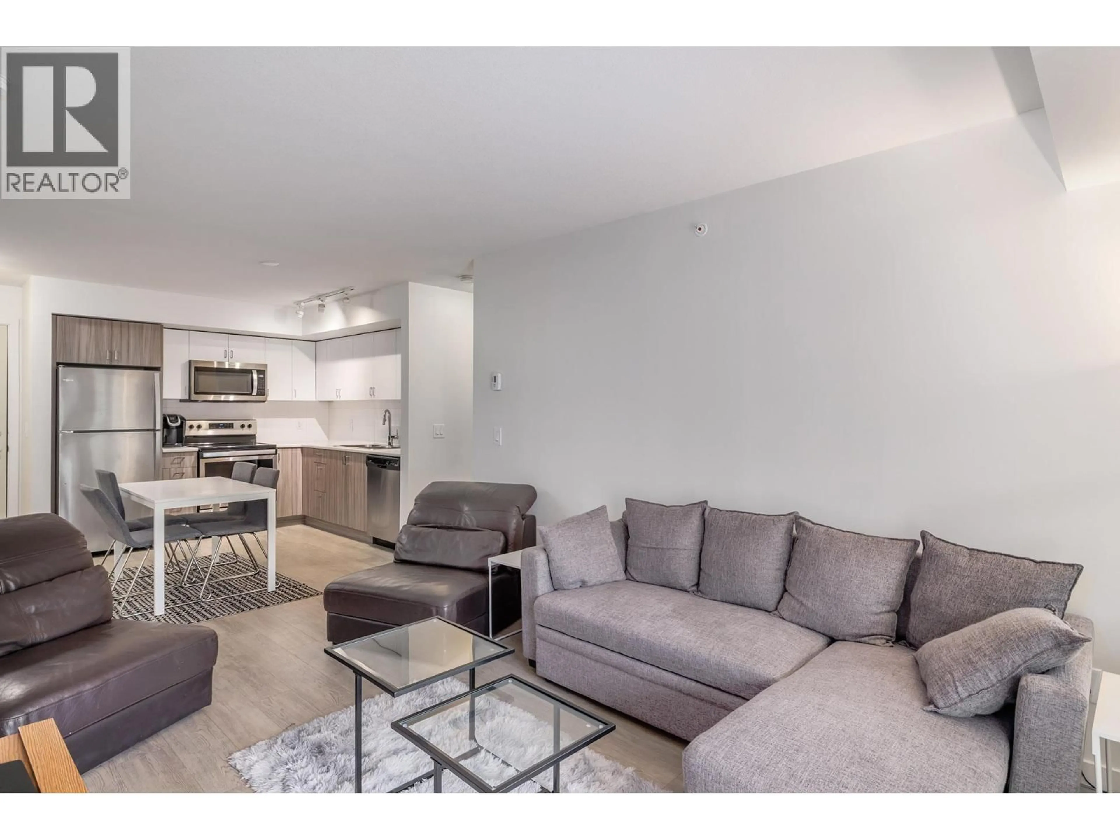 Living room with furniture, unknown for PH18 - 725 ACADEMY WAY, Kelowna British Columbia V1V3A4