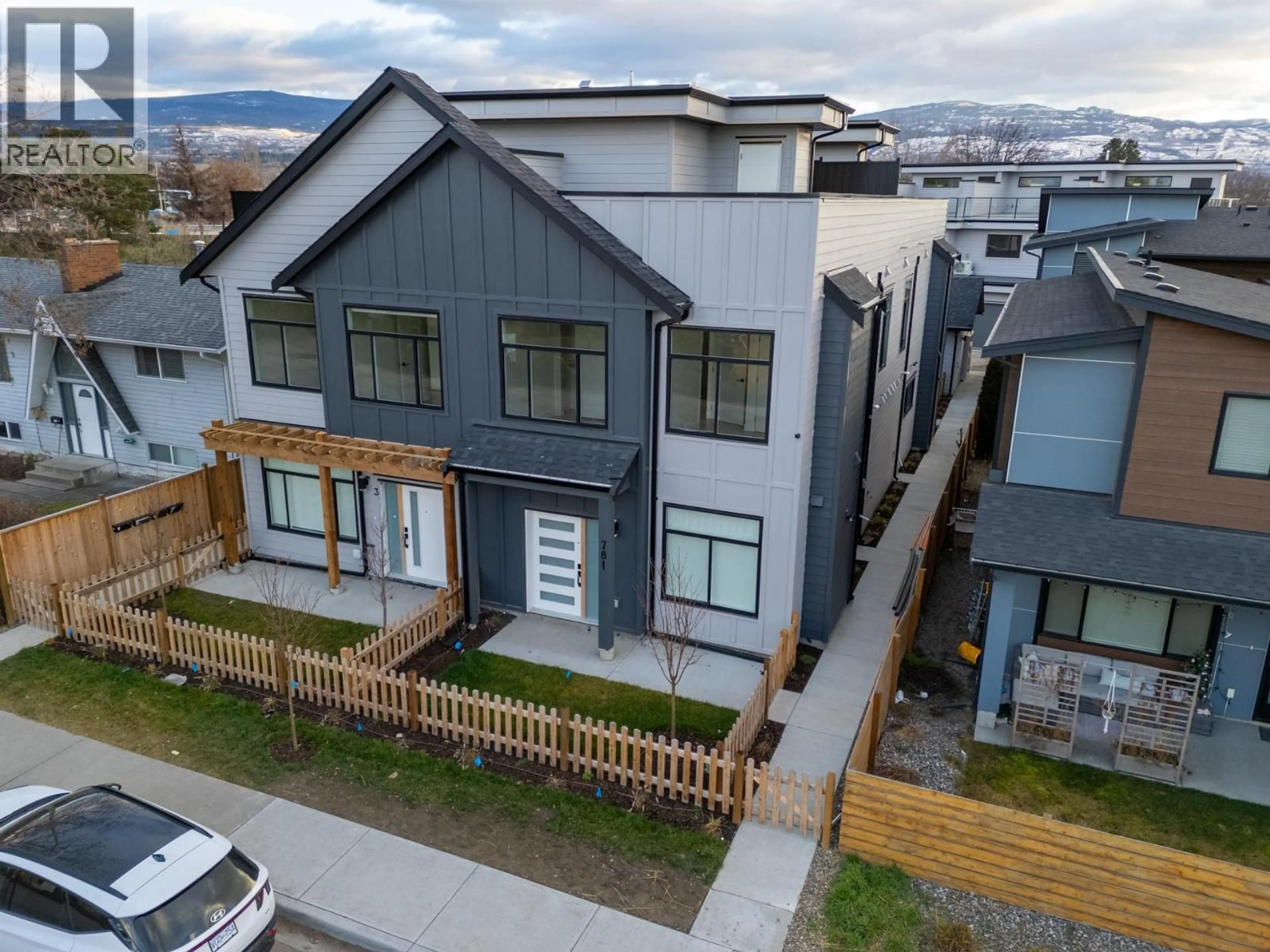 A pic from outside/outdoor area/front of a property/back of a property/a pic from drone, mountain view for 2 - 781 RAYMER AVENUE, Kelowna British Columbia V1Y4Z7