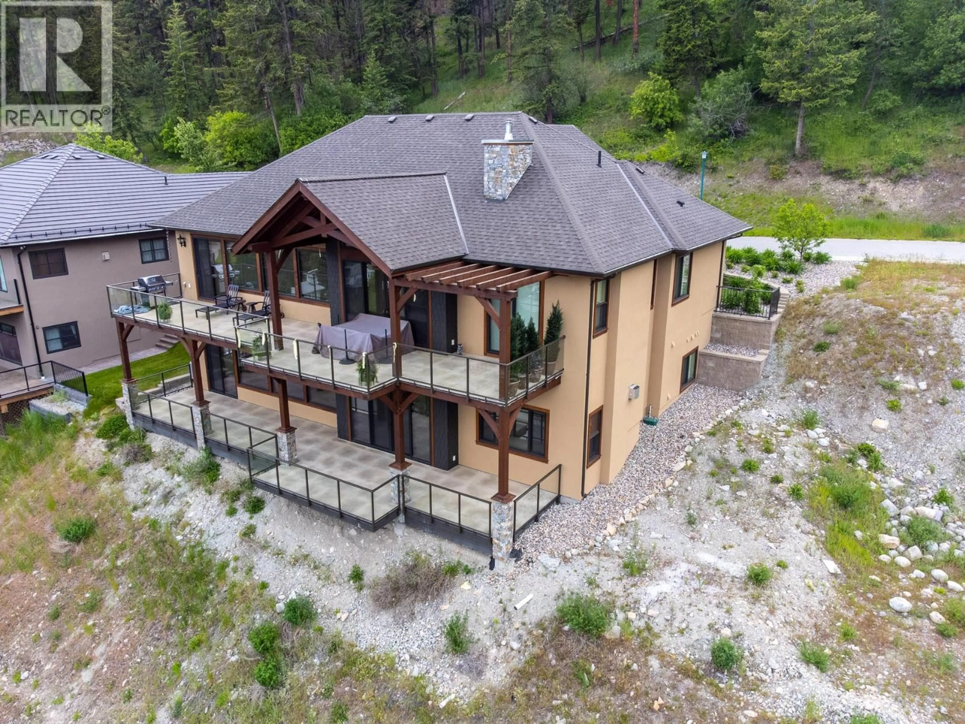 A pic from outside/outdoor area/front of a property/back of a property/a pic from drone, building for 6166 SEYMOURE AVENUE, Peachland British Columbia V0H1X4