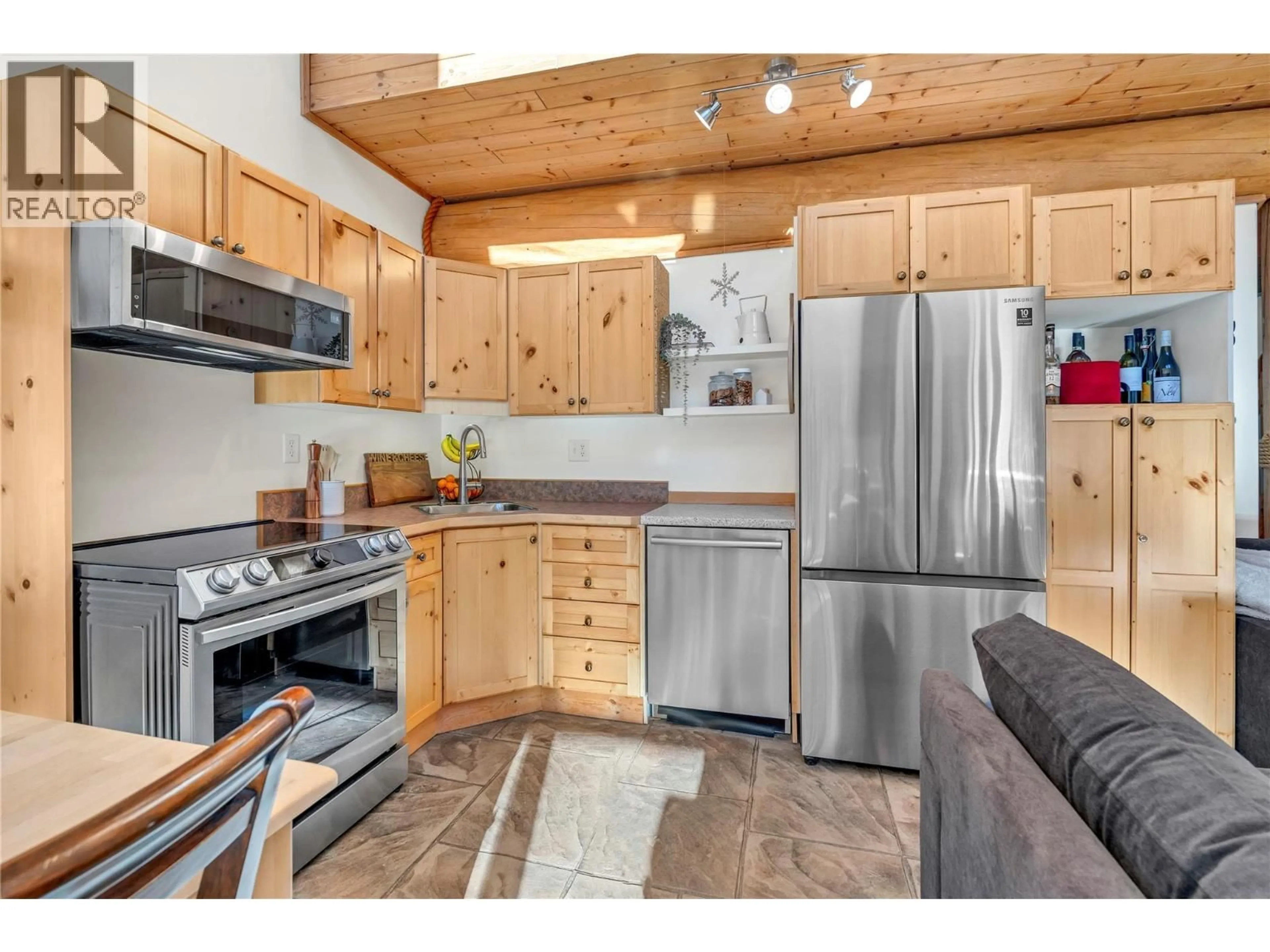 Open concept kitchen, wood/laminate floor for 306 - 1271 APEX MOUNTAIN ROAD, Penticton British Columbia V2A0E2