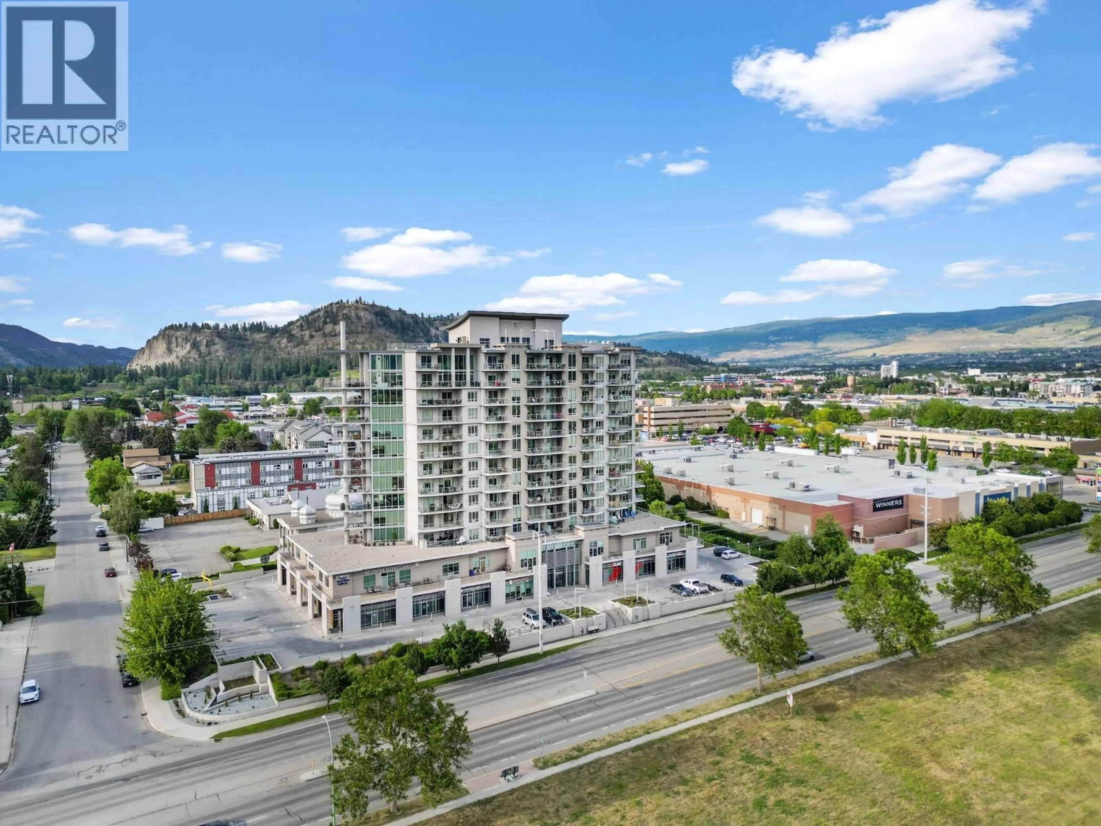 A pic from outside/outdoor area/front of a property/back of a property/a pic from drone, mountain view for 201 - 2040 SPRINGFIELD ROAD, Kelowna British Columbia V1Y9N7