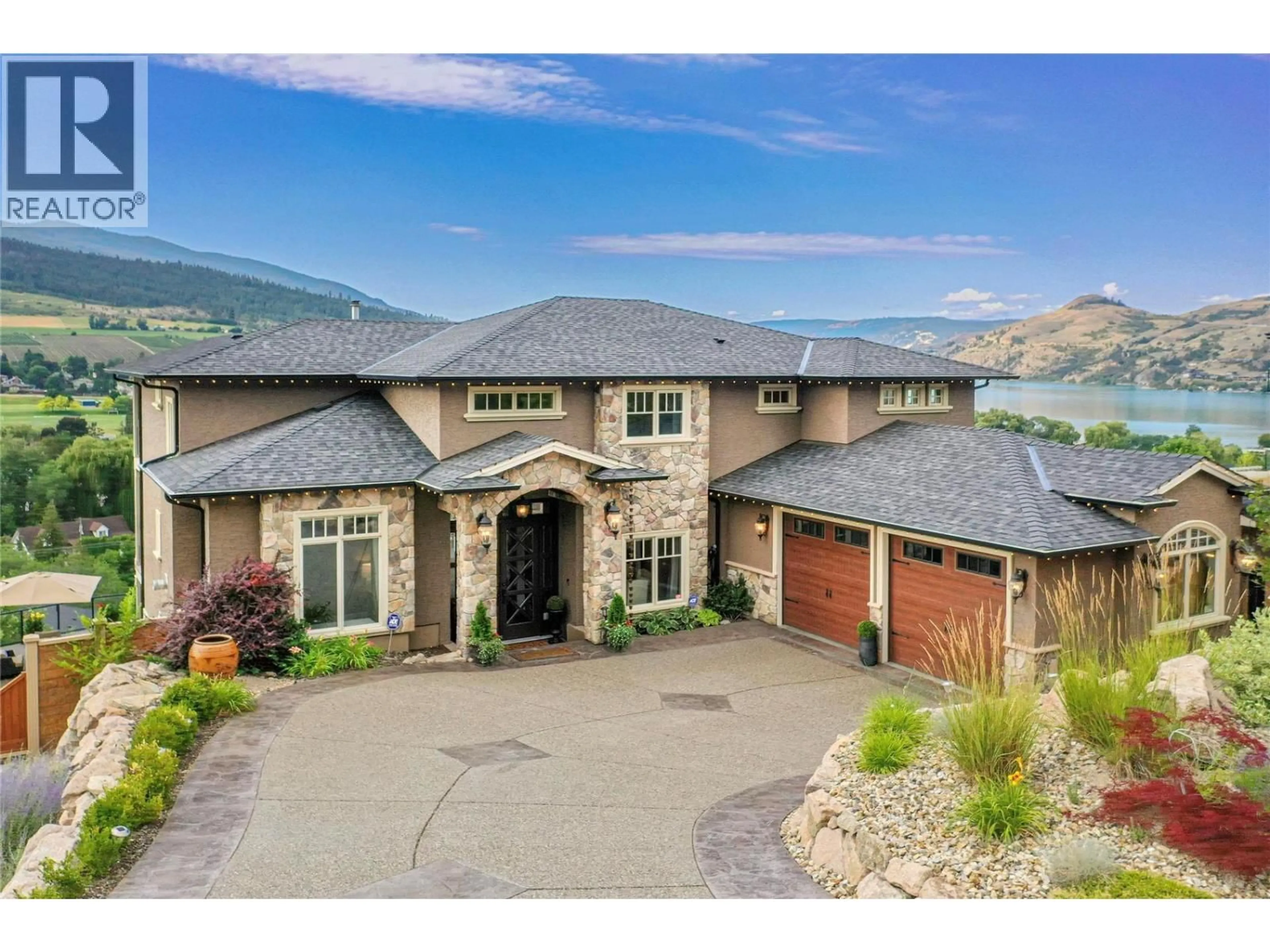 A pic from outside/outdoor area/front of a property/back of a property/a pic from drone, mountain view for 8784 CORTLAND PLACE, Coldstream British Columbia V1B4B8