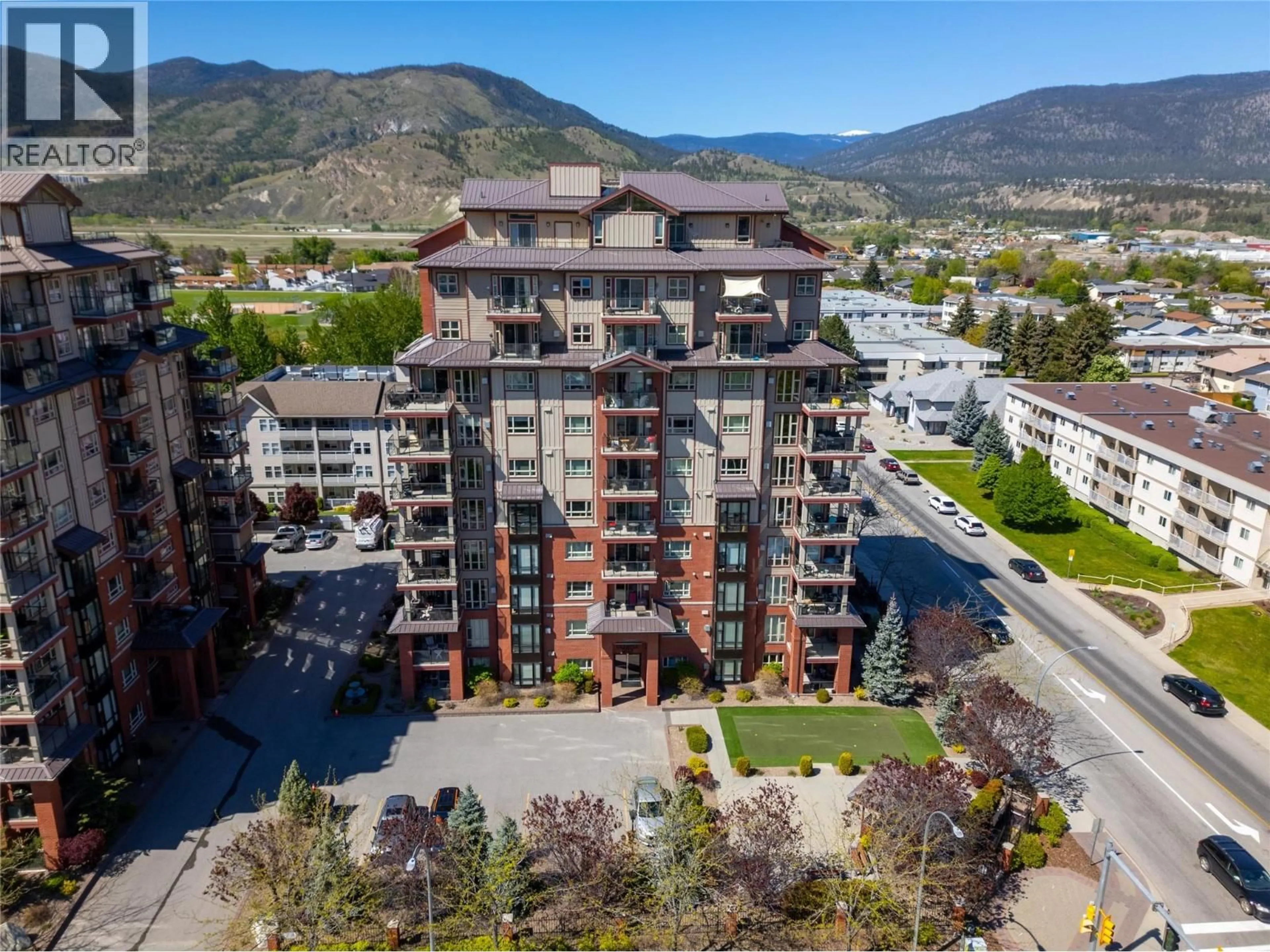 A pic from outside/outdoor area/front of a property/back of a property/a pic from drone, mountain view for 101 - 2113 ATKINSON STREET, Penticton British Columbia V2A8R5
