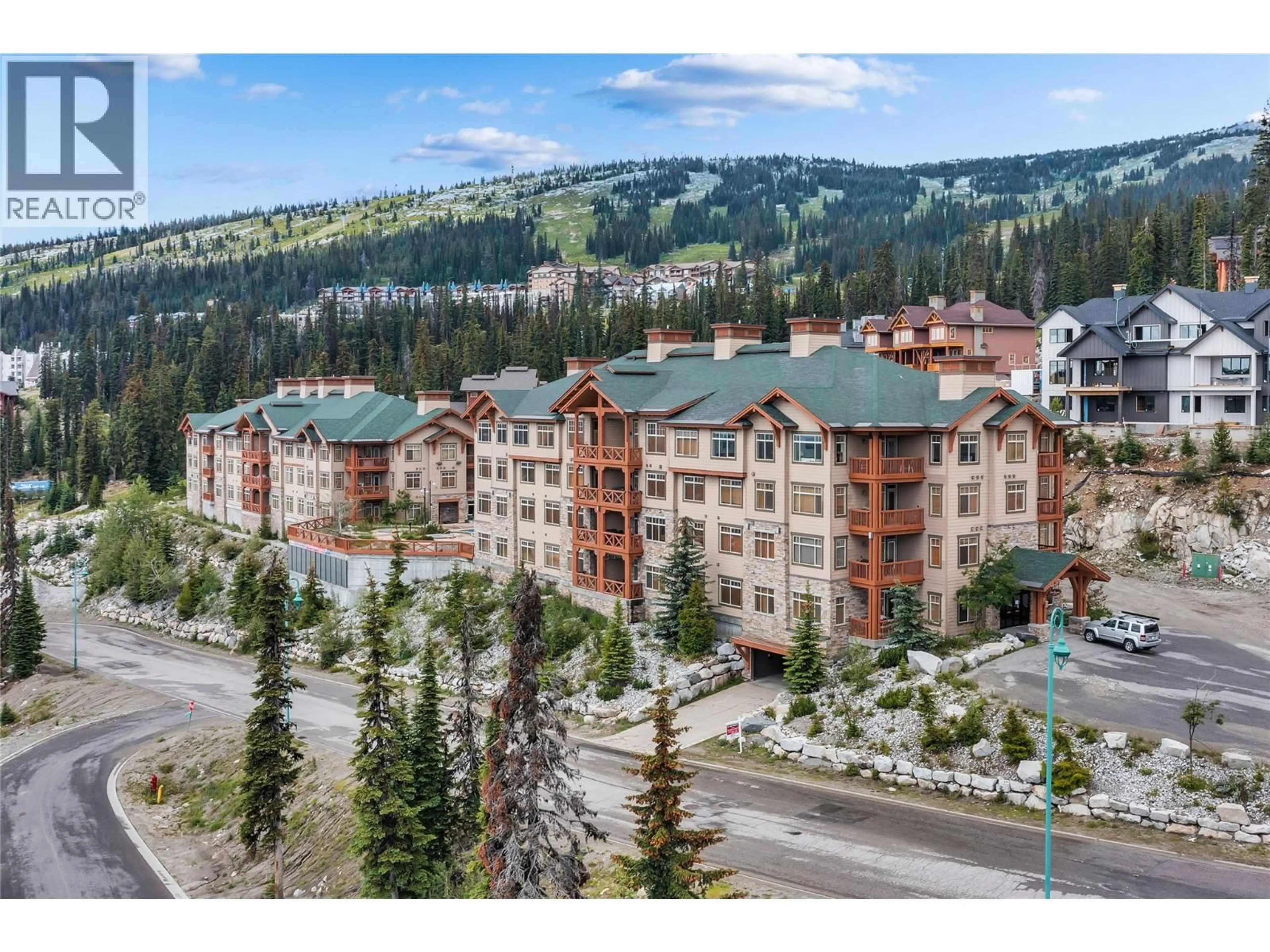 A pic from outside/outdoor area/front of a property/back of a property/a pic from drone, mountain view for 308/308A - 255 FEATHERTOP WAY, Big White British Columbia V1P1P3