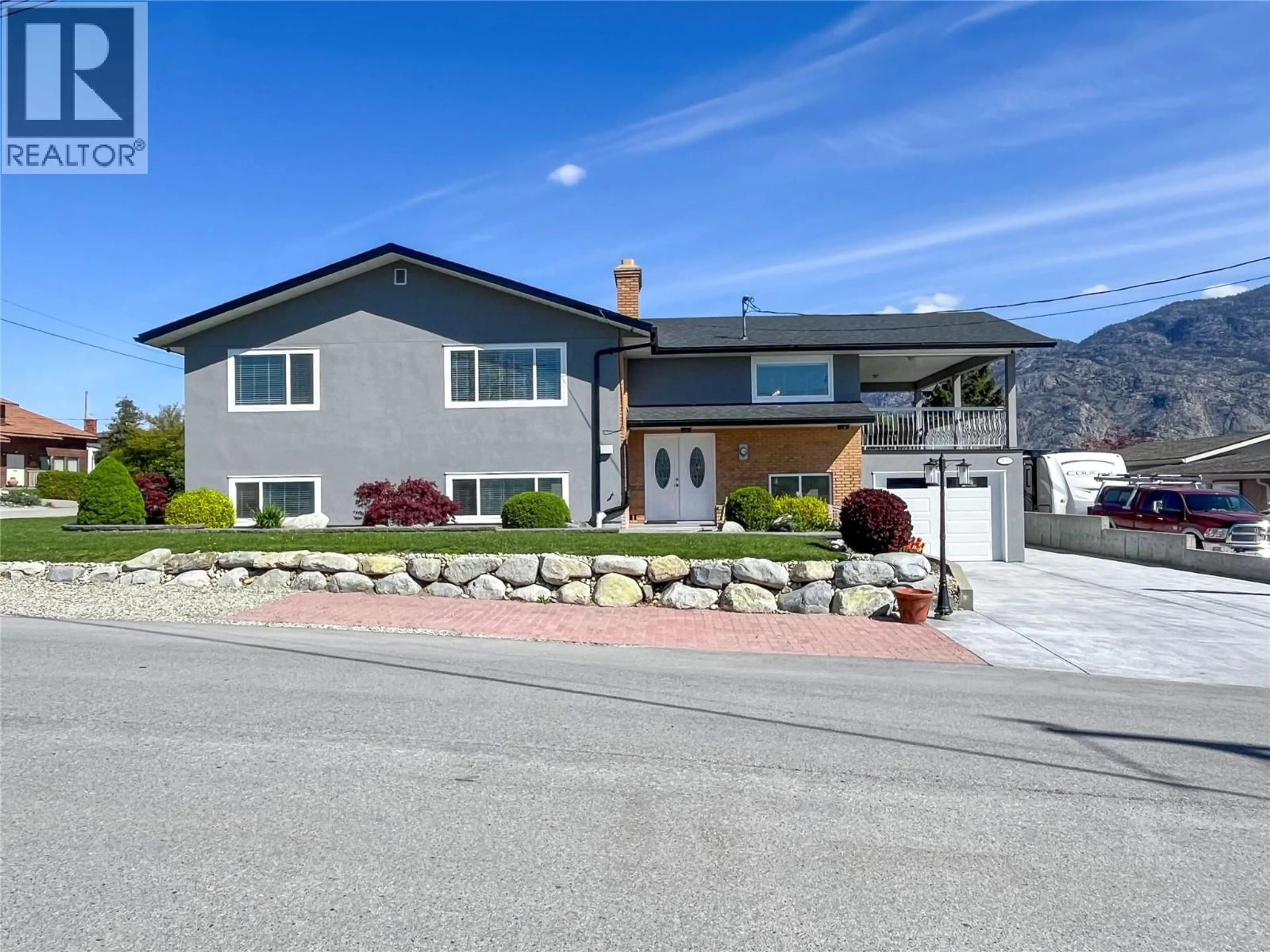 Home with vinyl exterior material, street for 9106 HUMMINGBIRD LANE, Osoyoos British Columbia V0H1V5