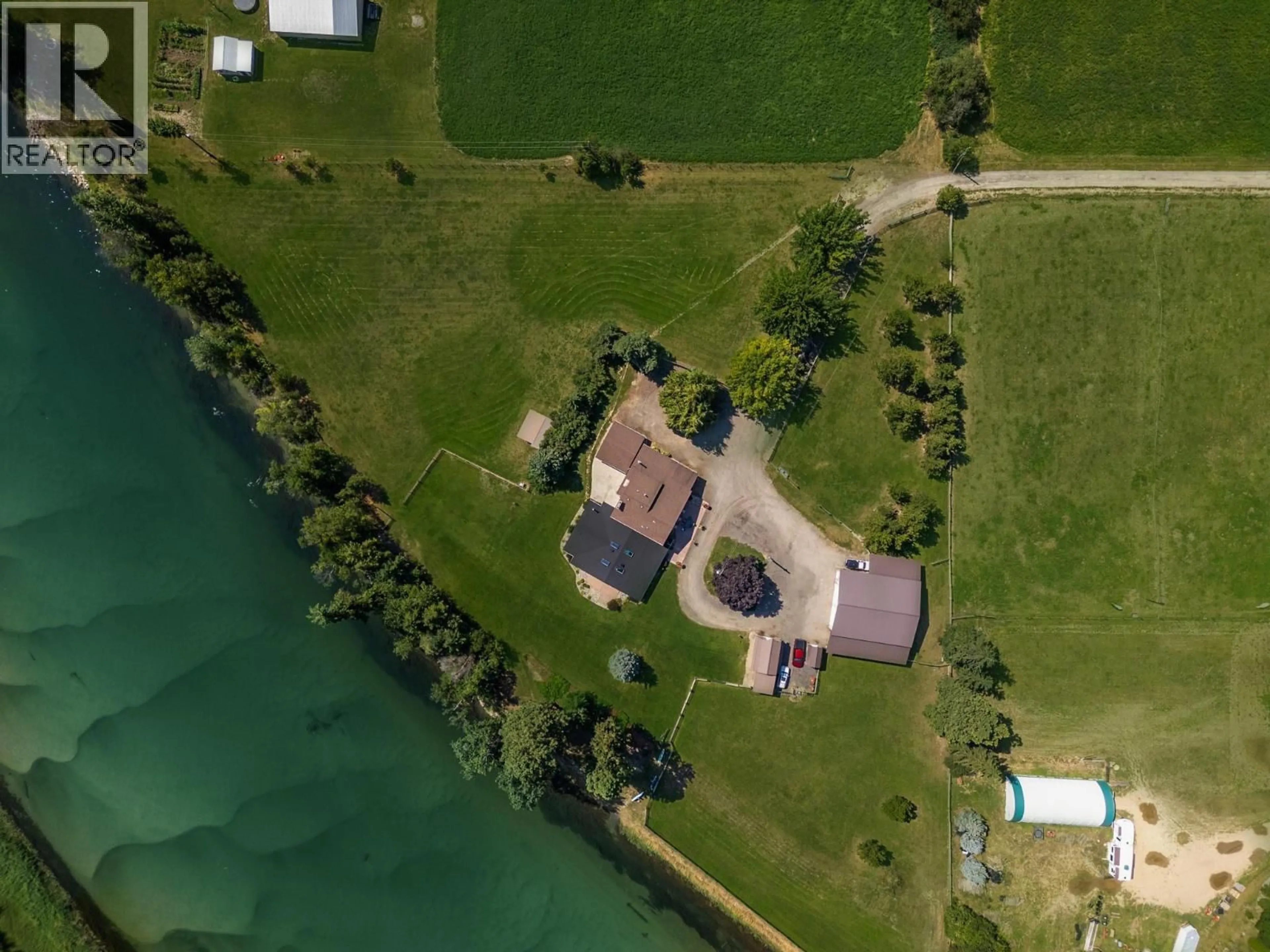 A pic from outside/outdoor area/front of a property/back of a property/a pic from drone, water/lake/river/ocean view for 48 WATERSIDE ROAD, Enderby British Columbia V4Y4G5