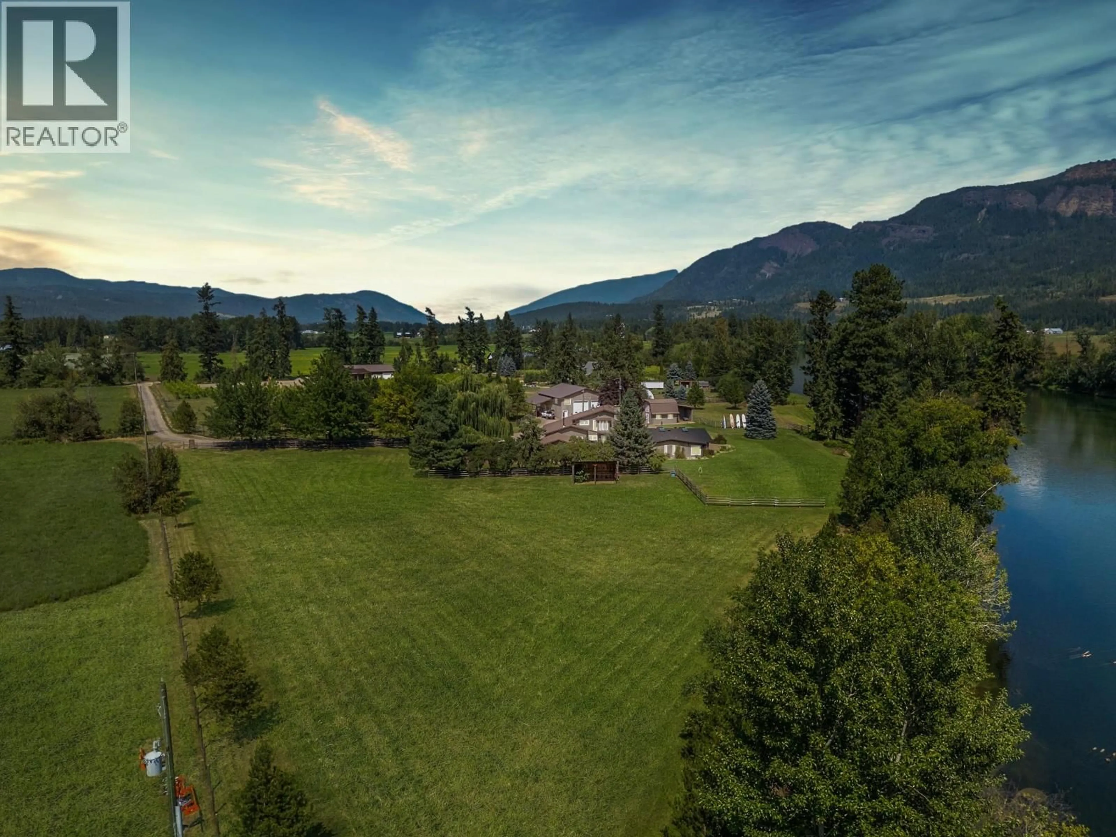 A pic from outside/outdoor area/front of a property/back of a property/a pic from drone, mountain view for 48 WATERSIDE ROAD, Enderby British Columbia V4Y4G5