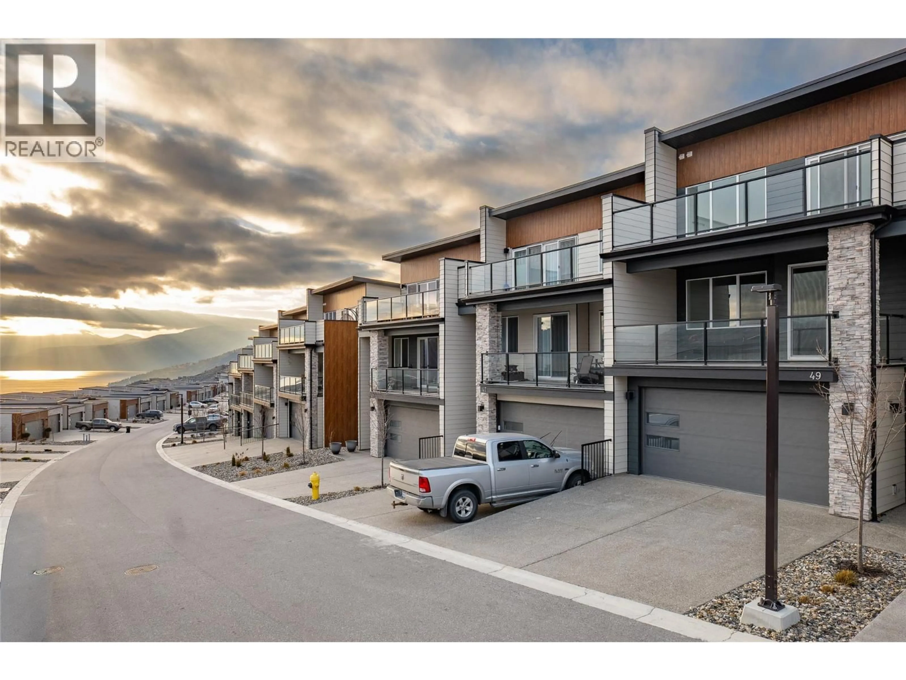 A pic from outside/outdoor area/front of a property/back of a property/a pic from drone, street for 49 - 7735 OKANAGAN HILLS BOULEVARD, Vernon British Columbia V1H0A7