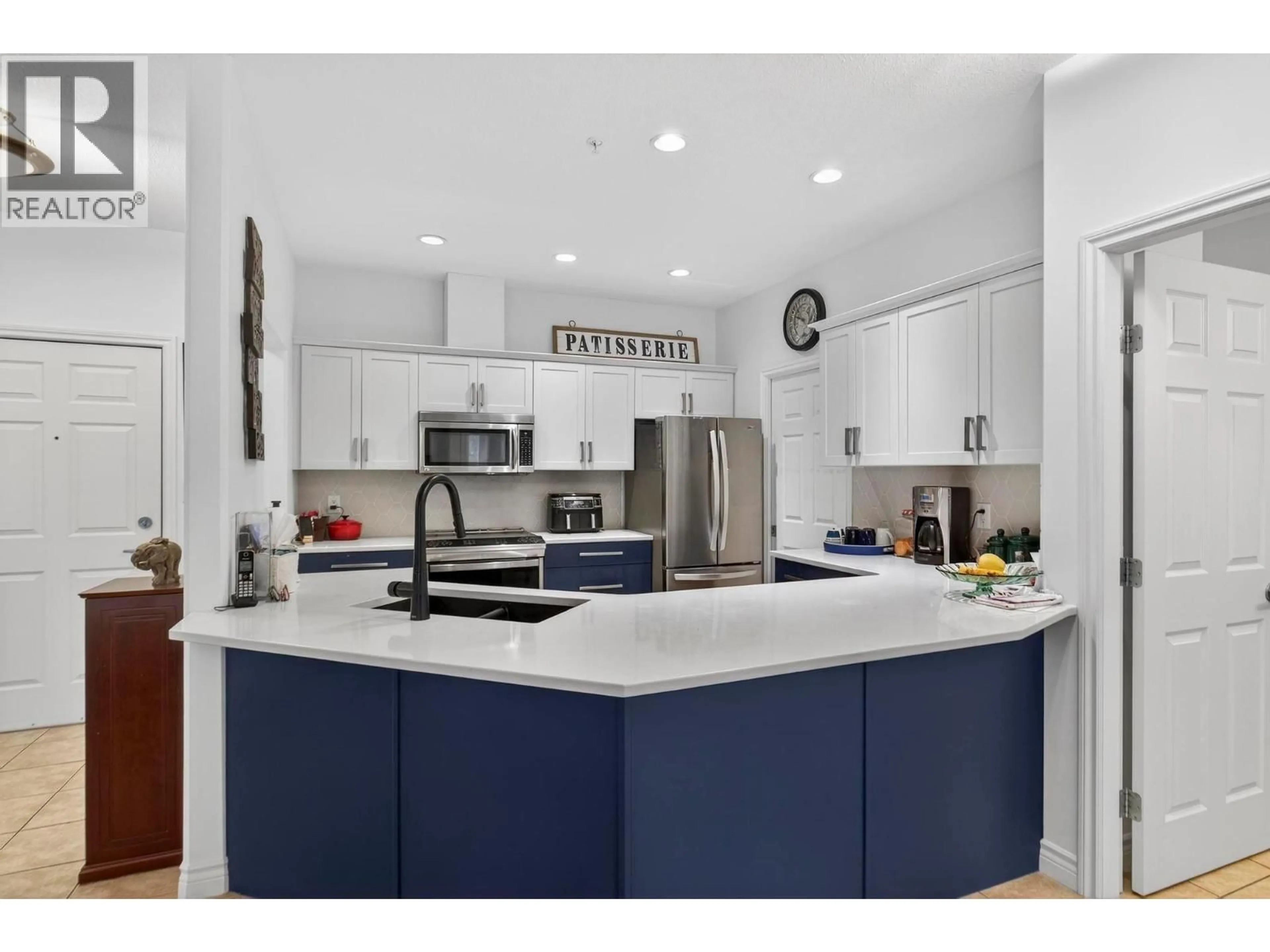 Contemporary kitchen, ceramic/tile floor for 211 - 1961 DURNIN ROAD, Kelowna British Columbia V1X7Z6