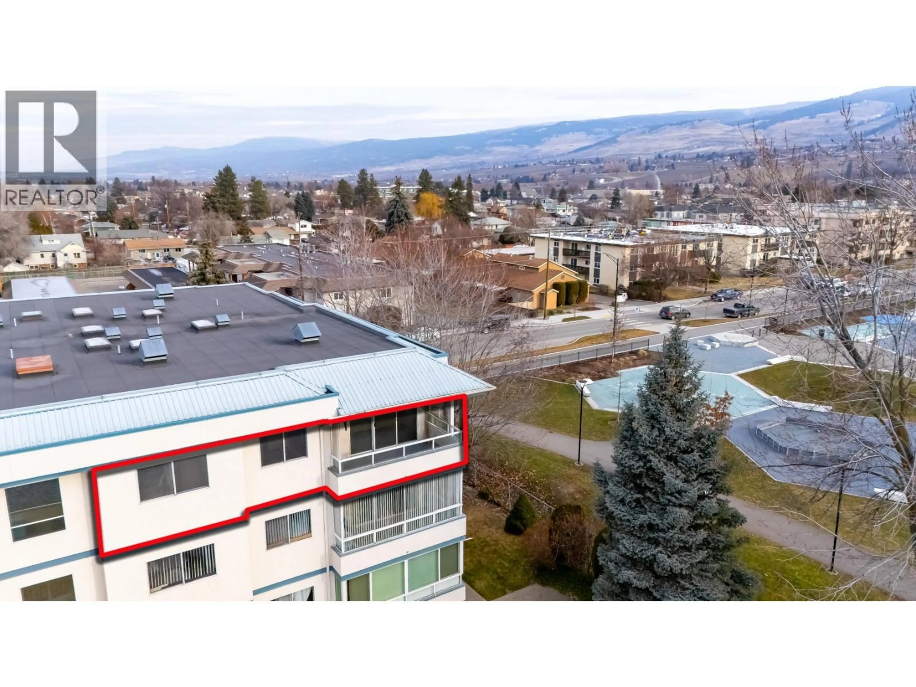 A pic from outside/outdoor area/front of a property/back of a property/a pic from drone, mountain view for 305 - 255 MCINTOSH ROAD, Kelowna British Columbia V1X2C5