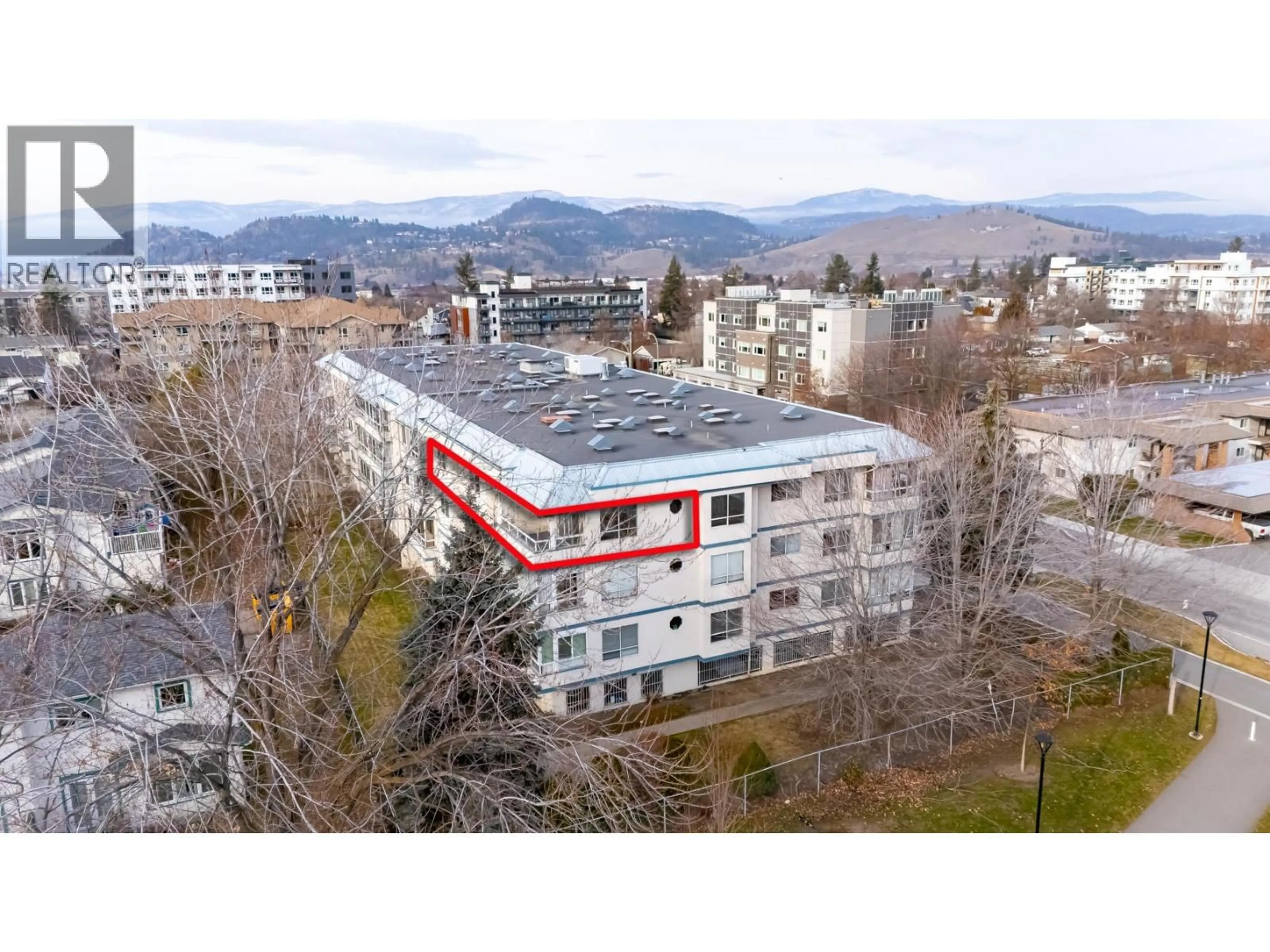 A pic from outside/outdoor area/front of a property/back of a property/a pic from drone, mountain view for 305 - 255 MCINTOSH ROAD, Kelowna British Columbia V1X2C5