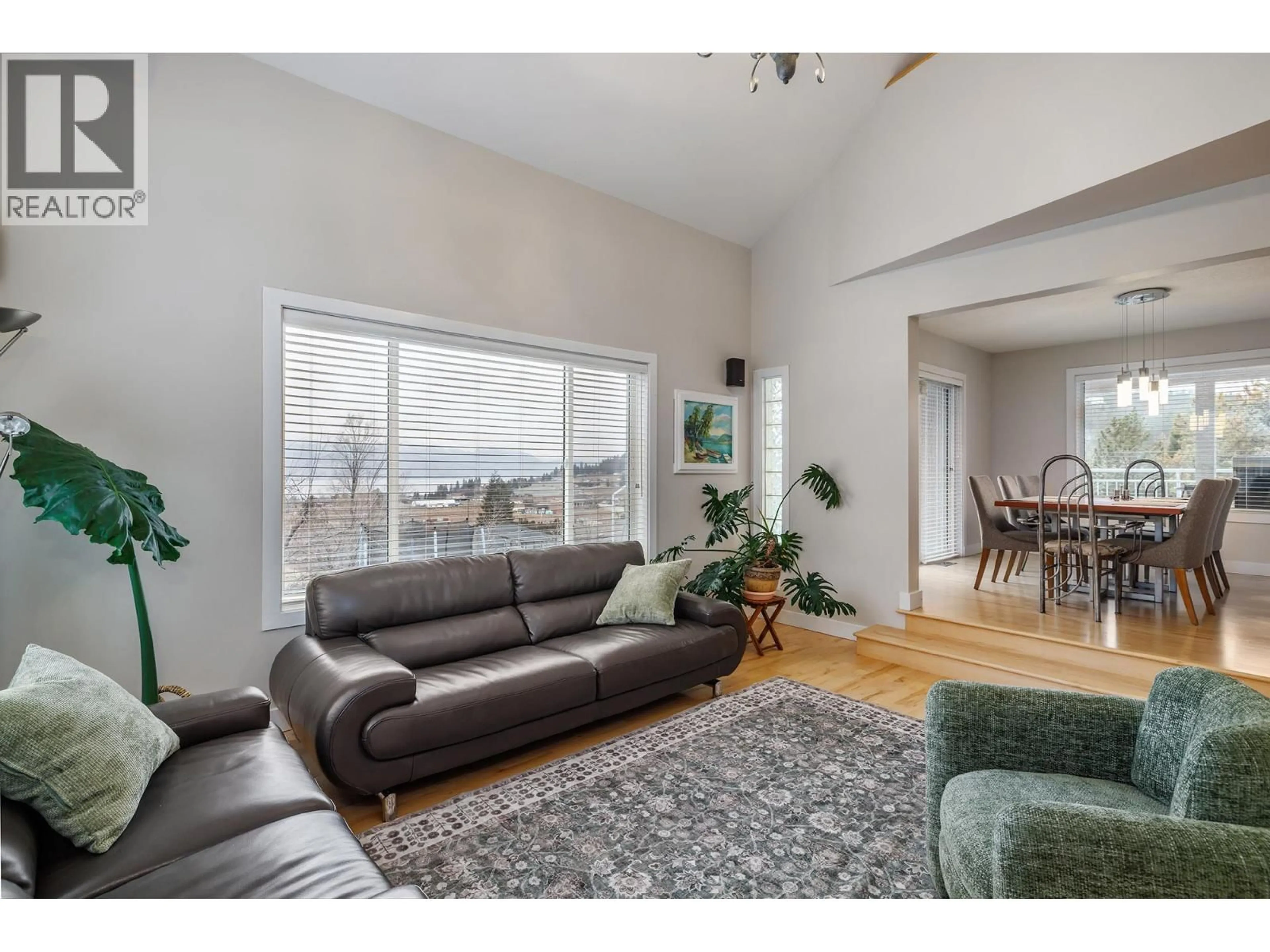 Living room with furniture, wood/laminate floor for 2761 OLALLA ROAD, West Kelowna British Columbia V1Z2B1