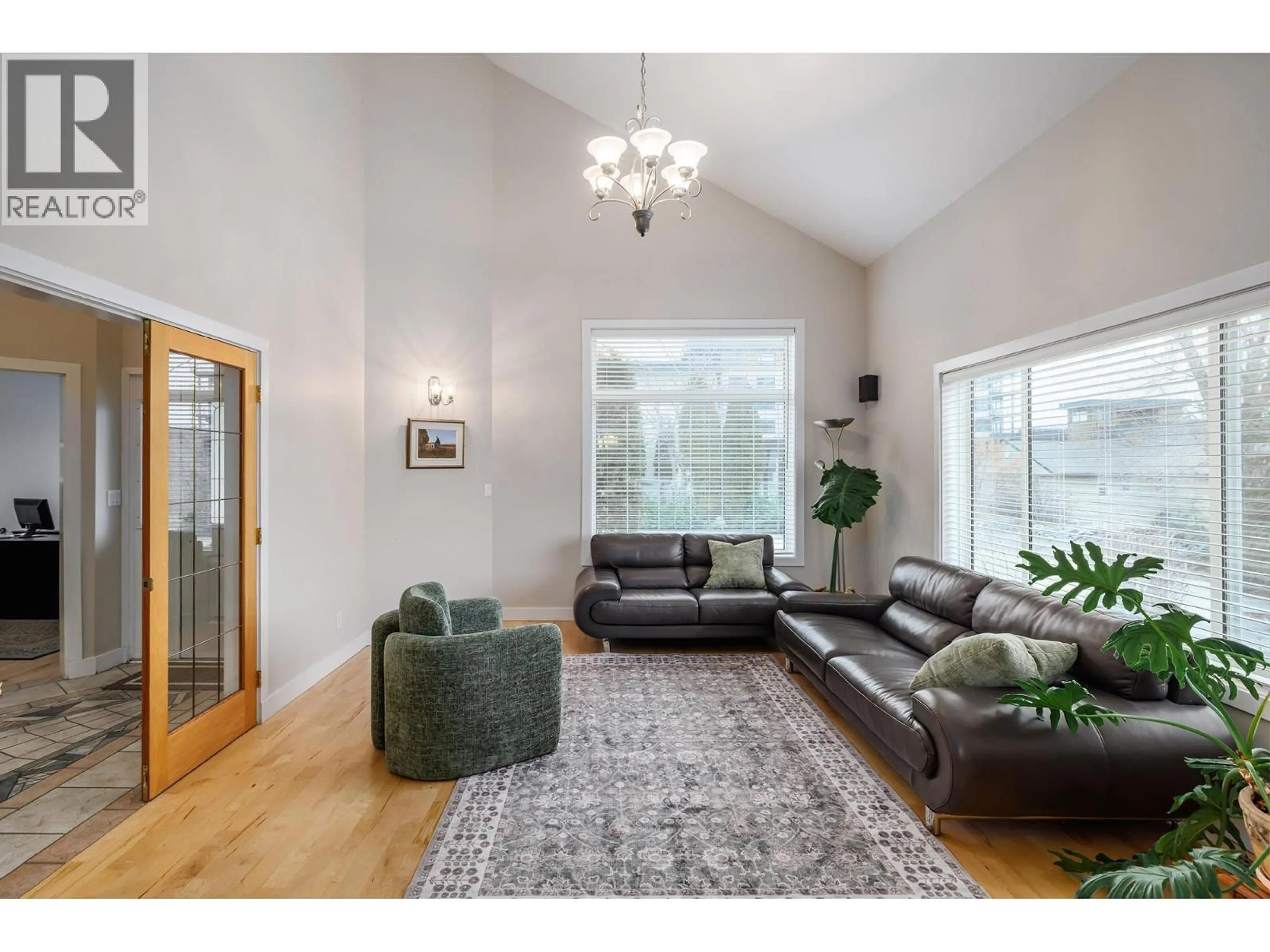 Living room with furniture, wood/laminate floor for 2761 OLALLA ROAD, West Kelowna British Columbia V1Z2B1