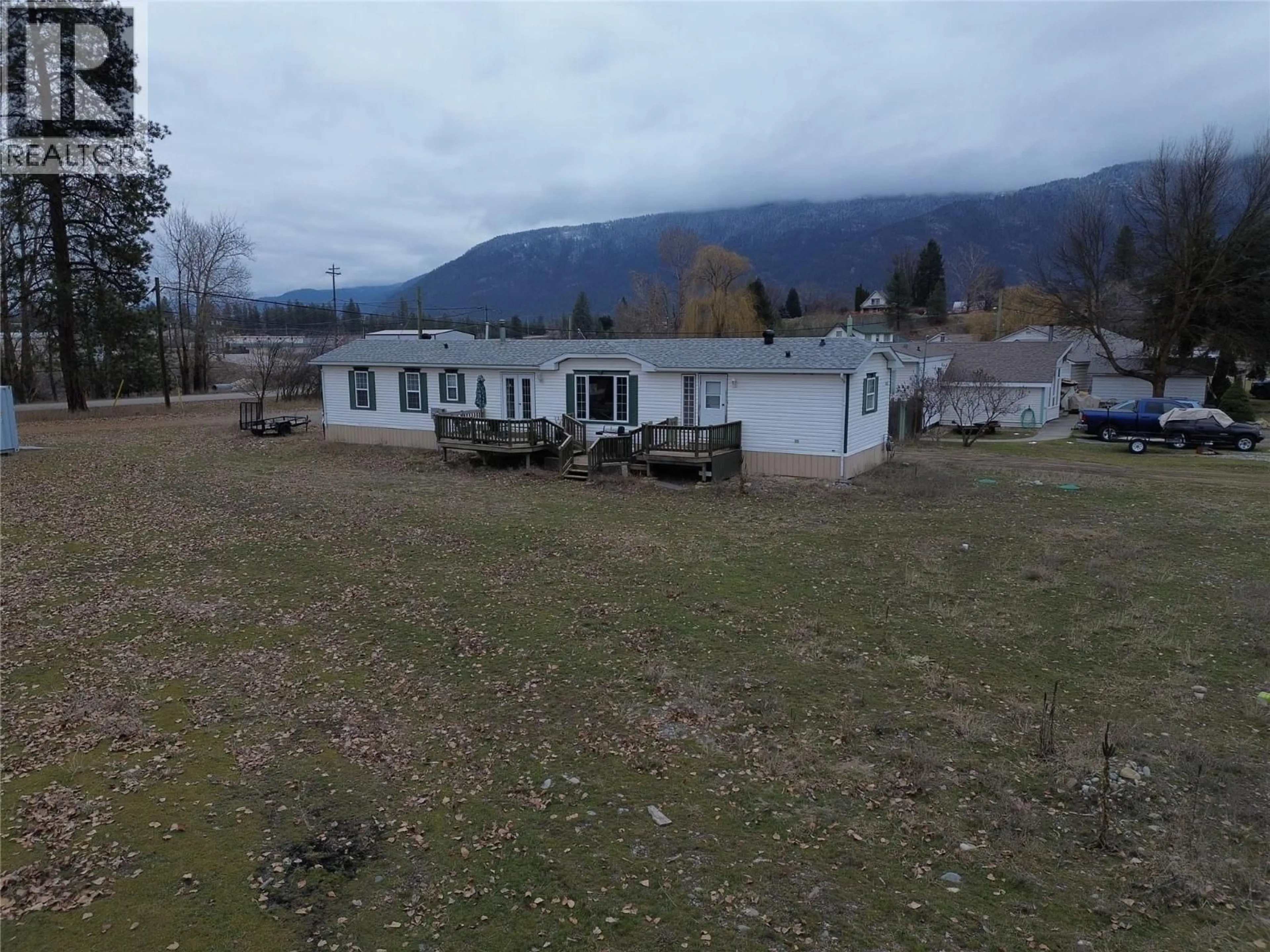 A pic from outside/outdoor area/front of a property/back of a property/a pic from drone, mountain view for 6473 5TH STREET, Grand Forks British Columbia V0H1H0