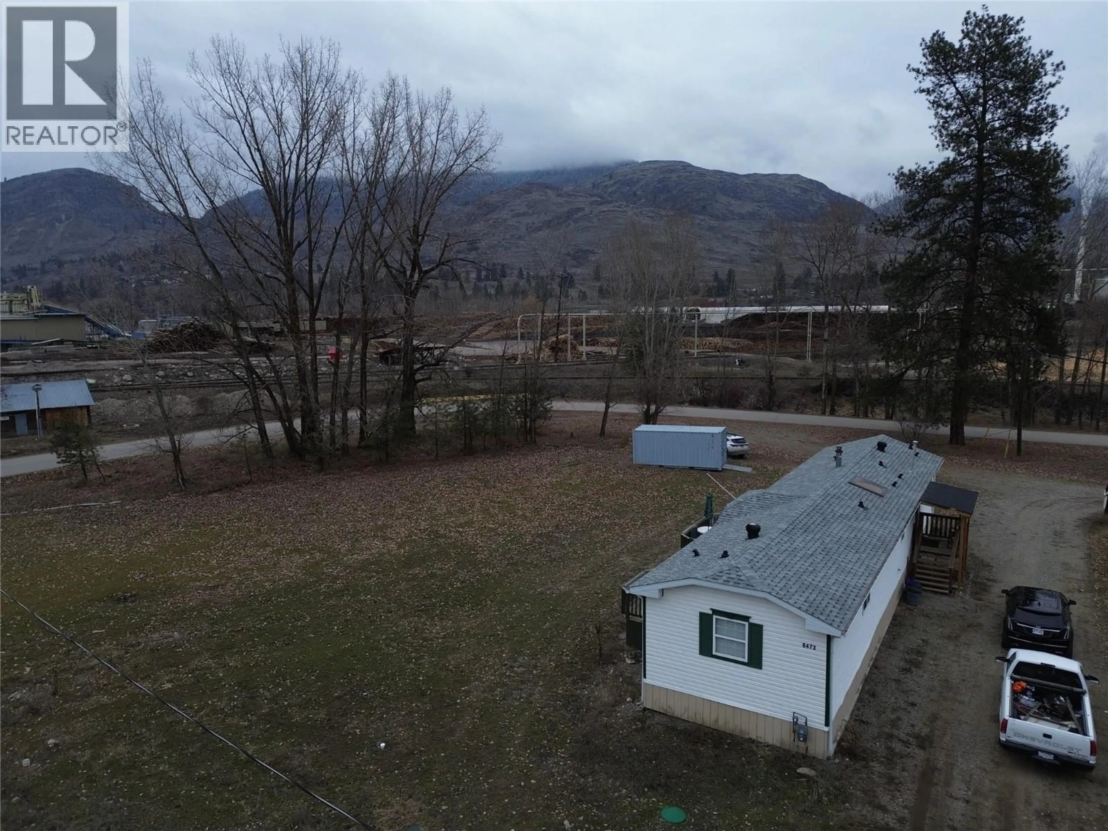 A pic from outside/outdoor area/front of a property/back of a property/a pic from drone, mountain view for 6473 5TH STREET, Grand Forks British Columbia V0H1H0