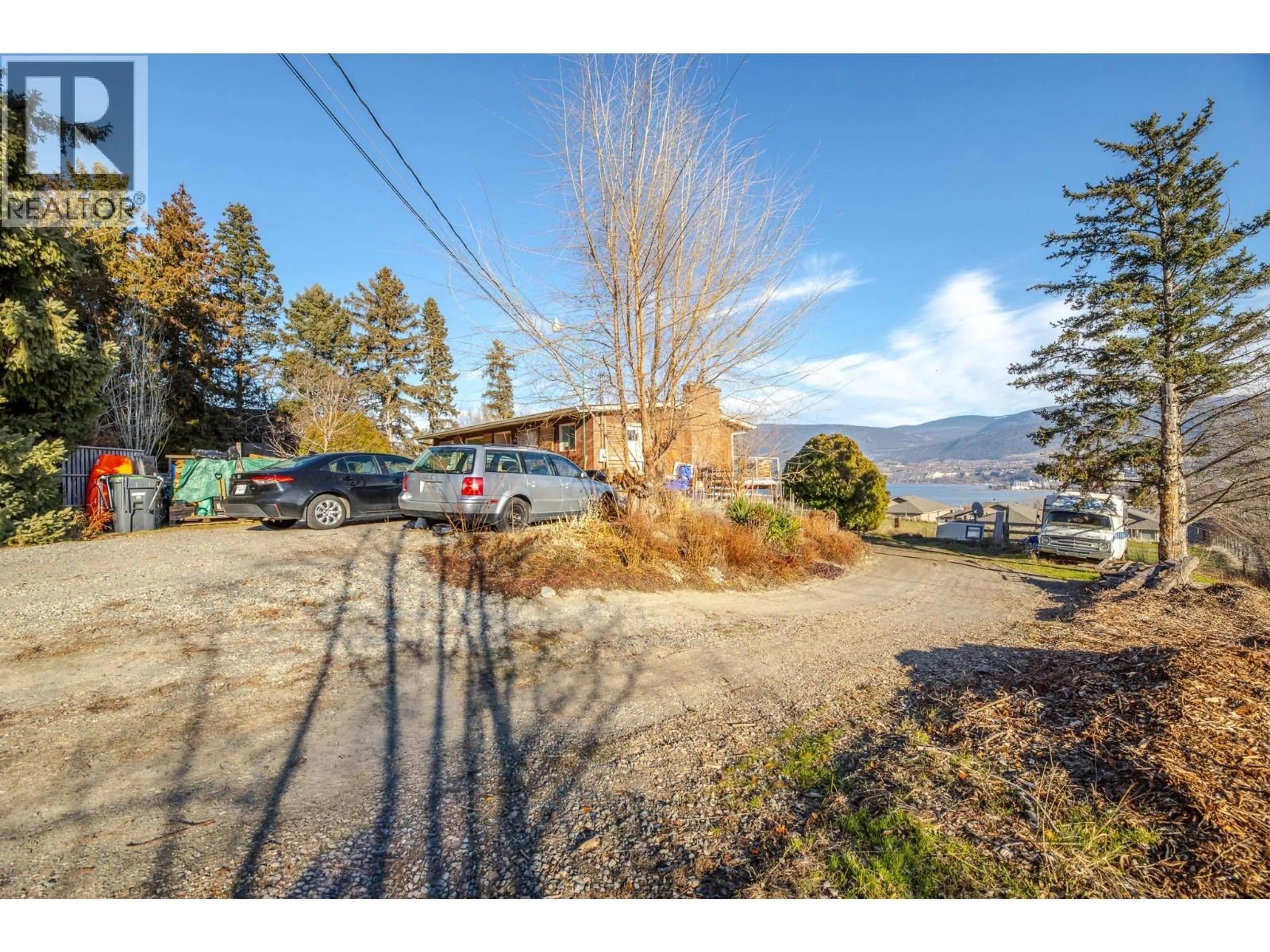 A pic from outside/outdoor area/front of a property/back of a property/a pic from drone, mountain view for 1411 SPARTAN DRIVE, Penticton British Columbia V2A8Z5