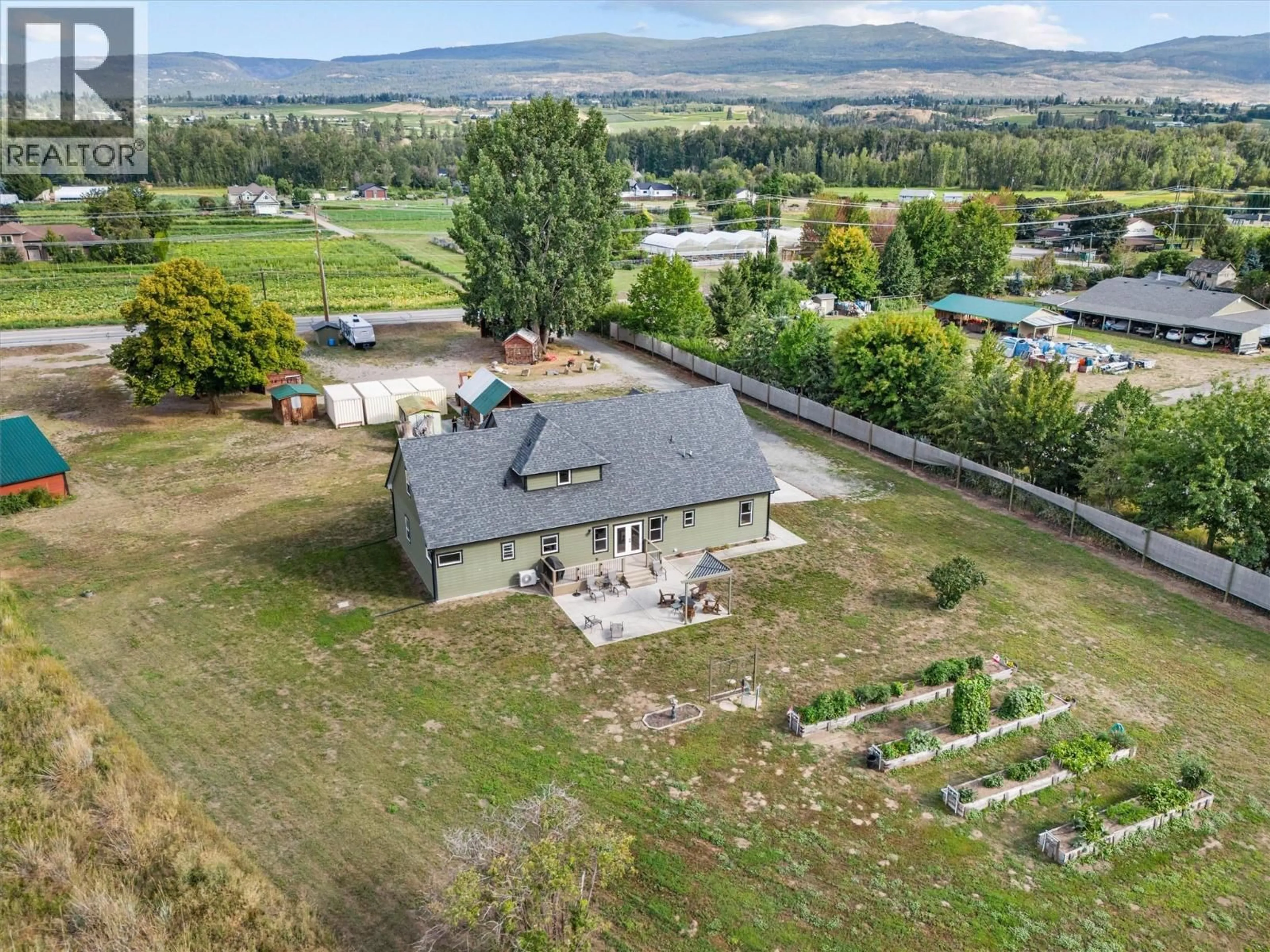 A pic from outside/outdoor area/front of a property/back of a property/a pic from drone, mountain view for 3550 BENVOULIN ROAD, Kelowna British Columbia V1W4M6