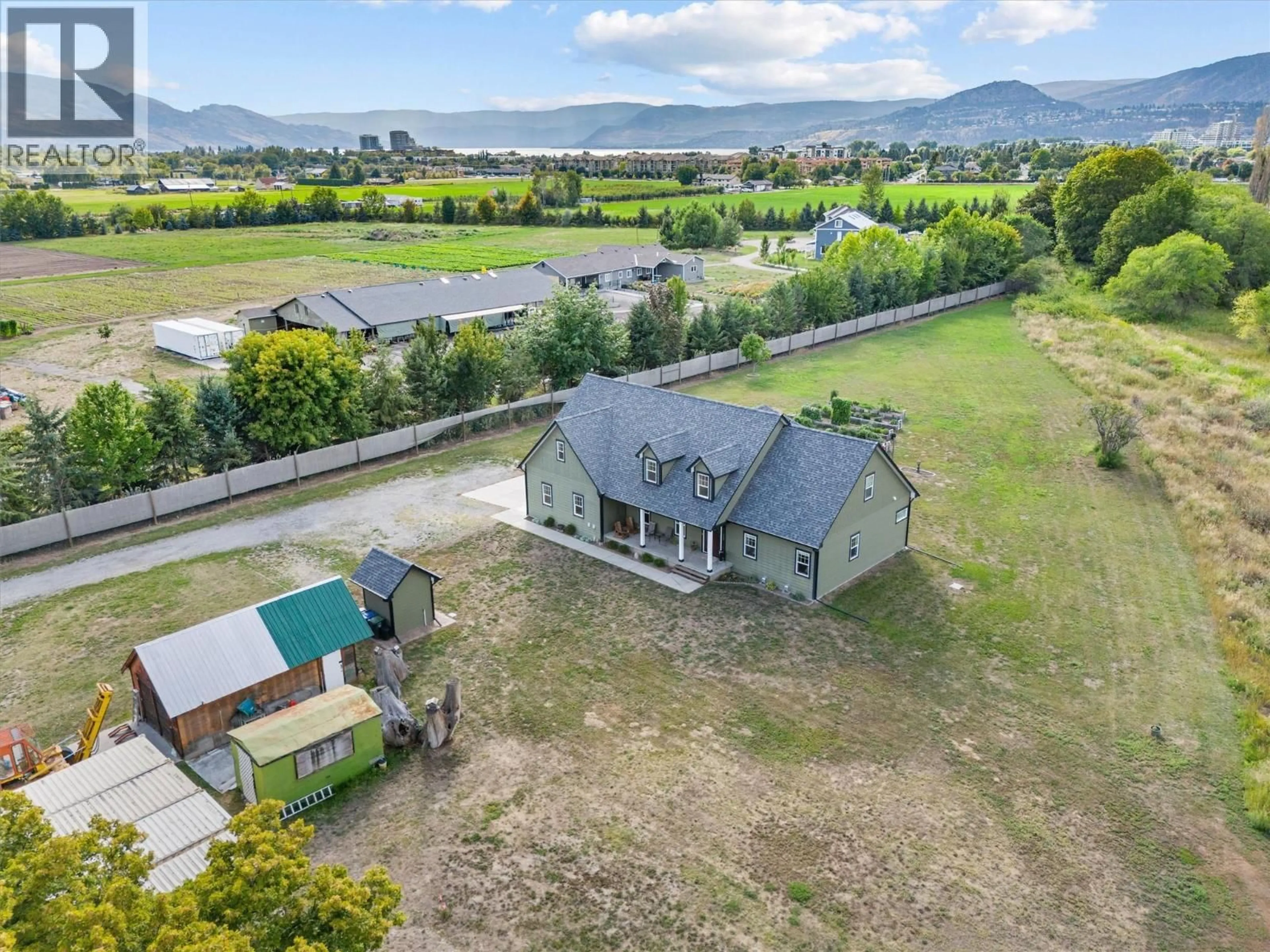A pic from outside/outdoor area/front of a property/back of a property/a pic from drone, mountain view for 3550 BENVOULIN ROAD, Kelowna British Columbia V1W4M6