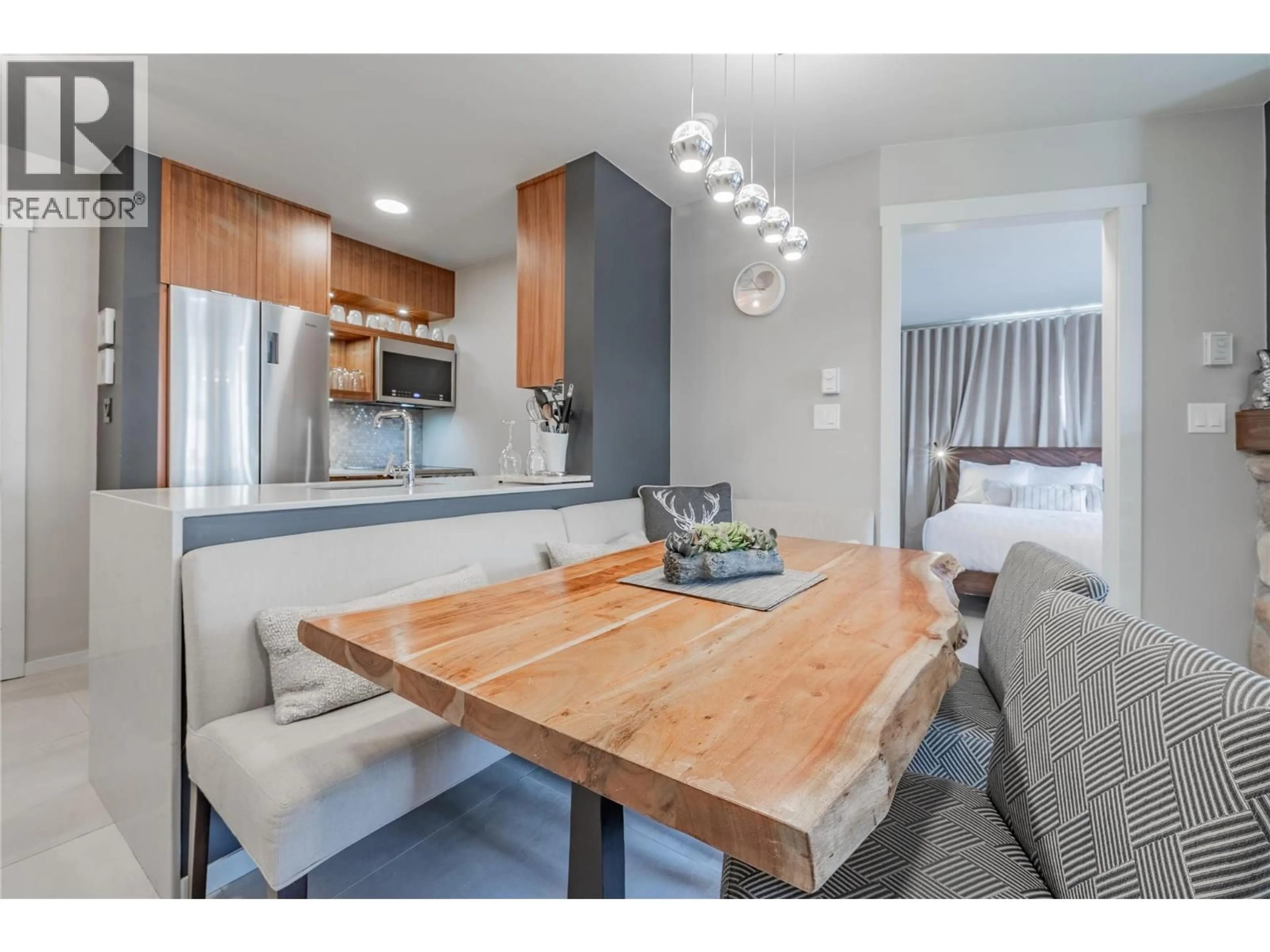 Open concept kitchen, wood/laminate floor for 202 - 2050 SUMMIT DRIVE, Panorama British Columbia V0A1T0