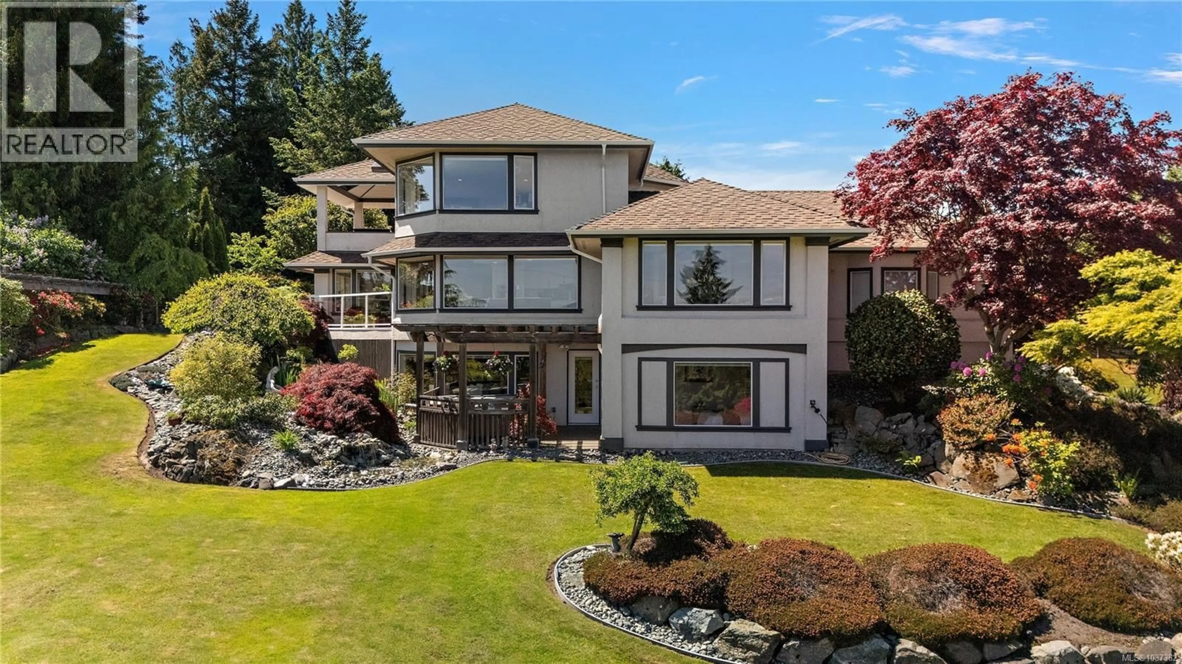 A pic from outside/outdoor area/front of a property/back of a property/a pic from drone, water/lake/river/ocean view for 11096 GREENPARK DRIVE, North Saanich British Columbia V8L5N5
