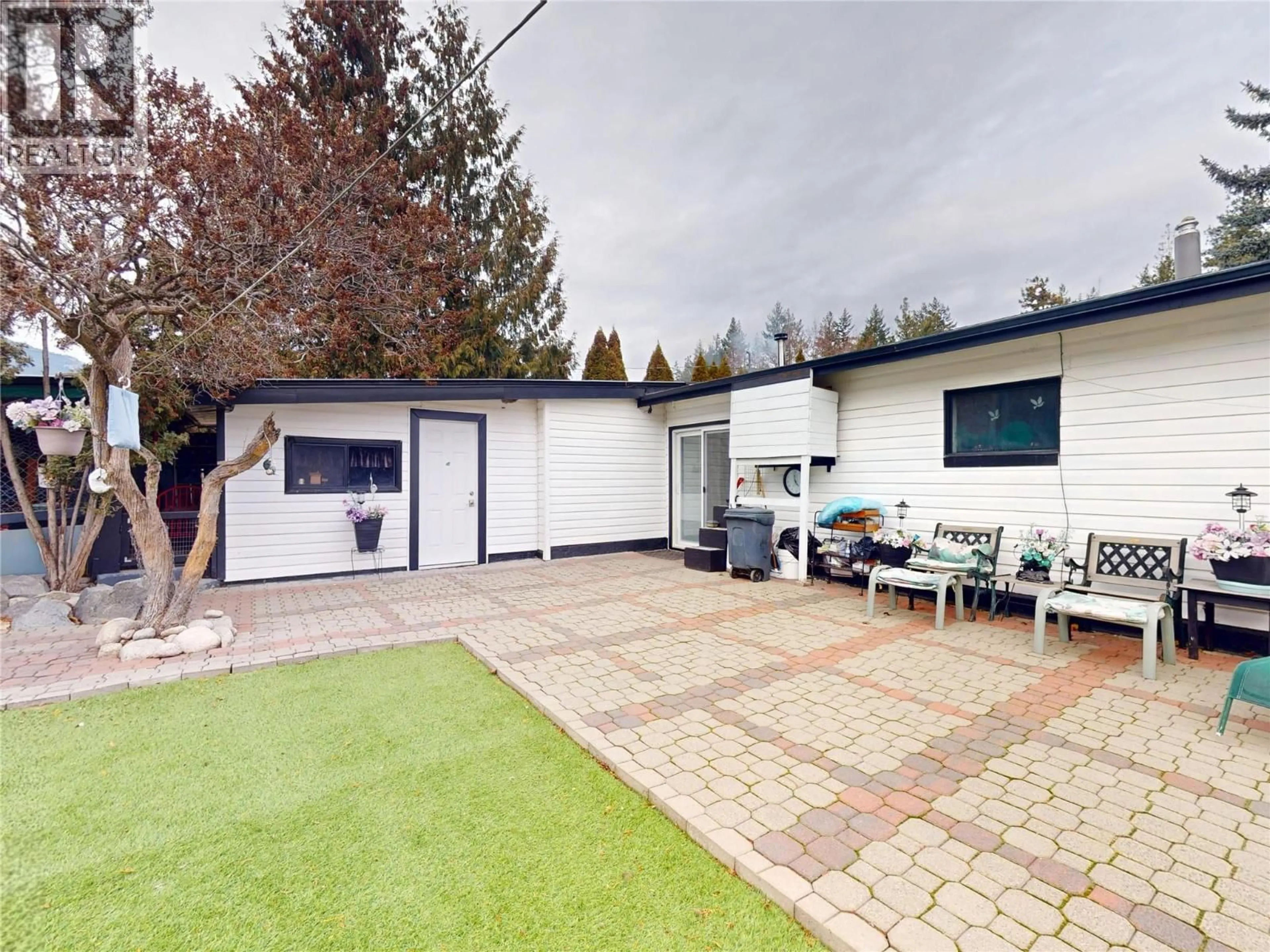 A pic from outside/outdoor area/front of a property/back of a property/a pic from drone, street for 5186 MACKINNON ROAD, Peachland British Columbia V0H1X2