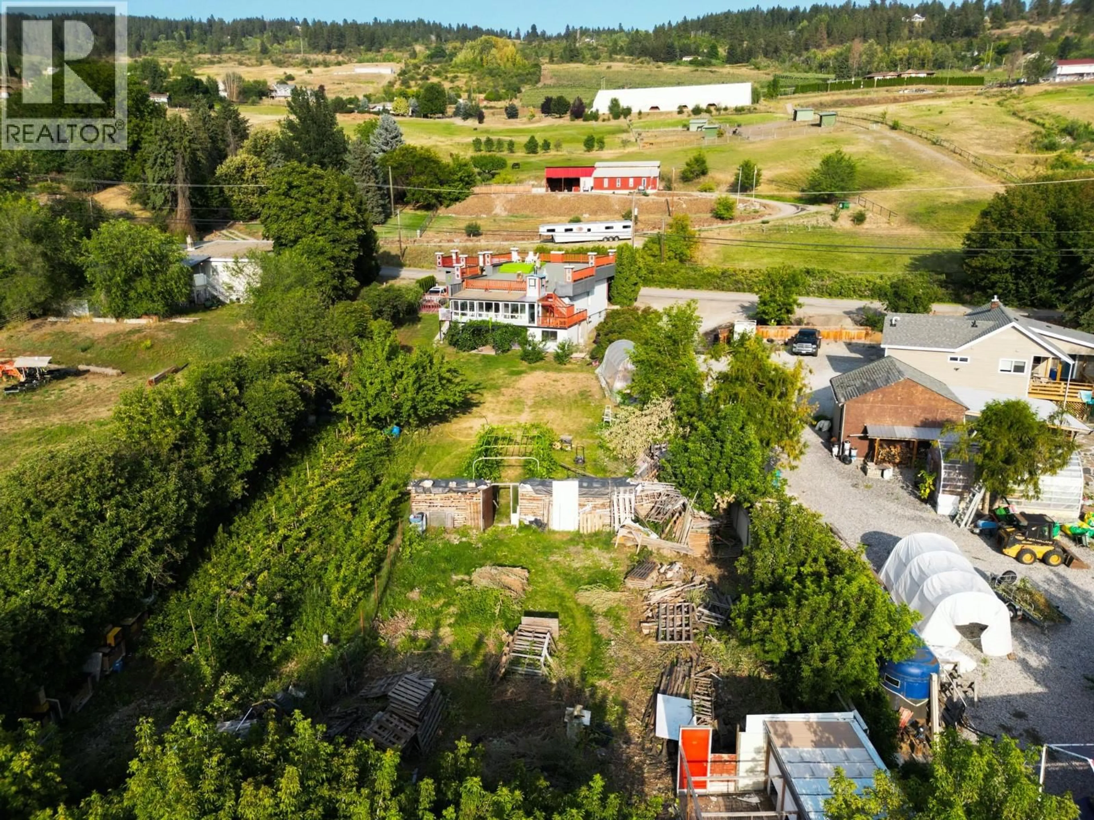 A pic from outside/outdoor area/front of a property/back of a property/a pic from drone, unknown for 7880 PLEASANT VALLEY ROAD, Vernon British Columbia V1B3R9