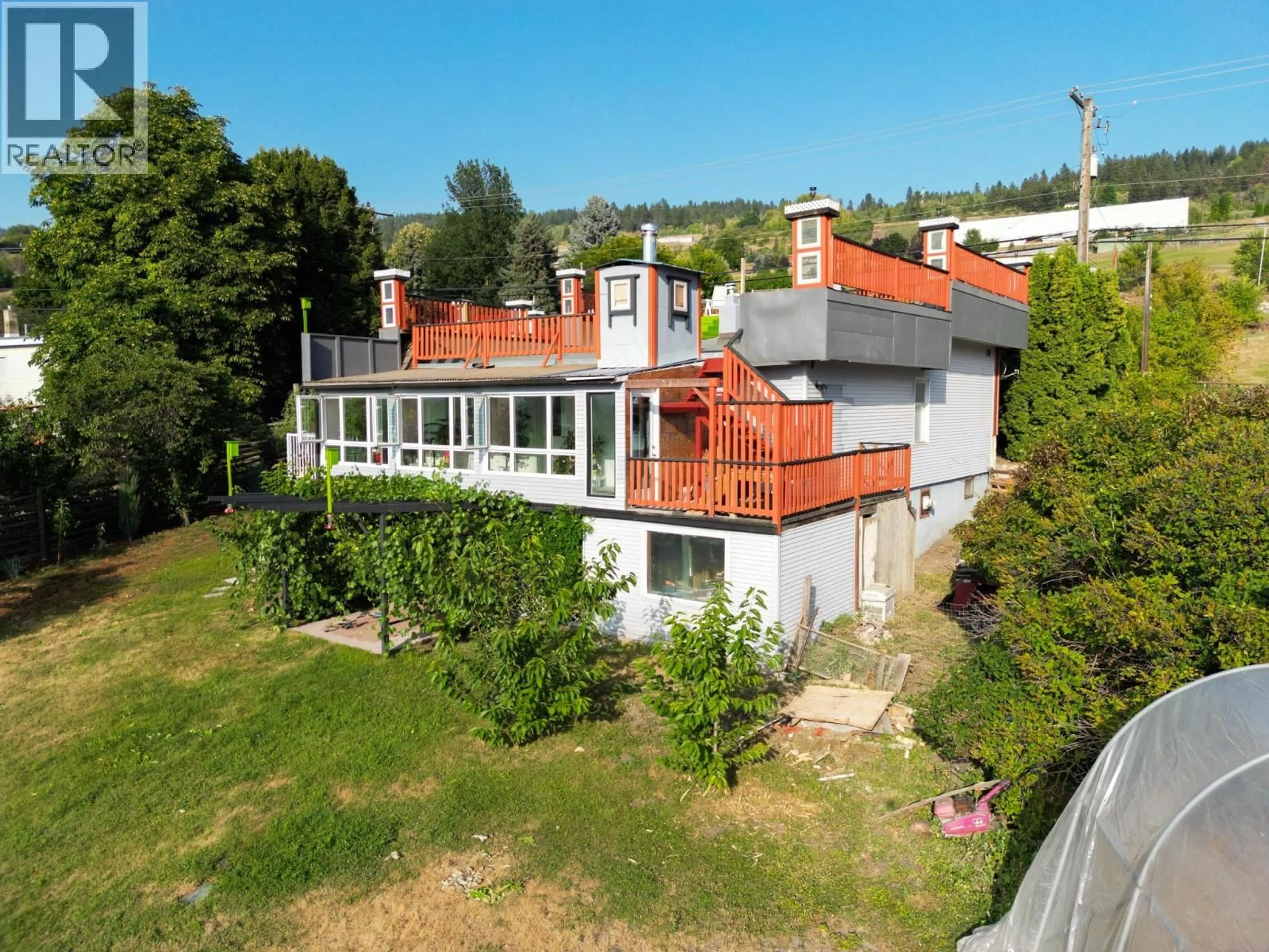 A pic from outside/outdoor area/front of a property/back of a property/a pic from drone, building for 7880 PLEASANT VALLEY ROAD, Vernon British Columbia V1B3R9