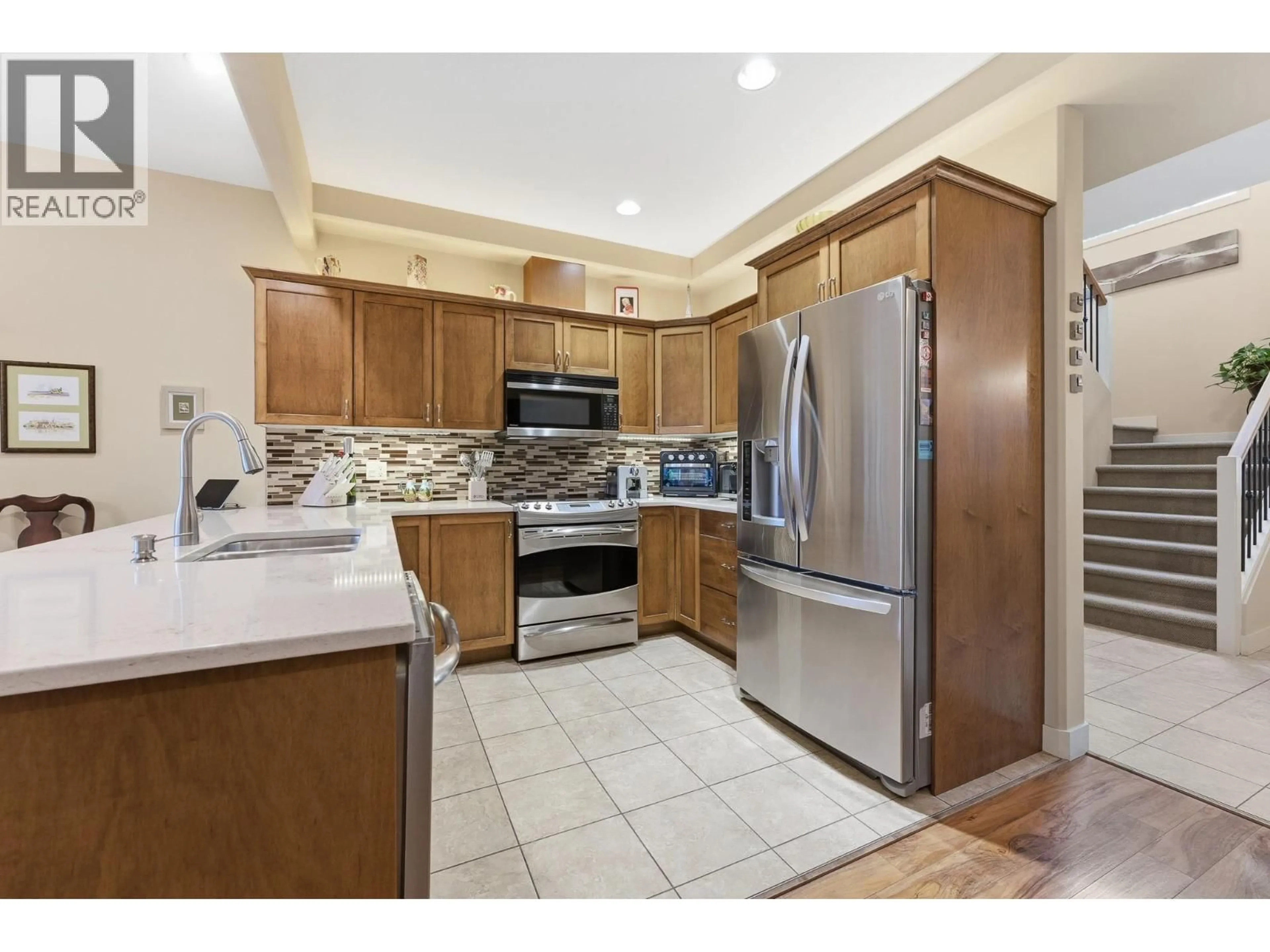 Open concept kitchen, ceramic/tile floor for 3 - 4610 20 STREET, Vernon British Columbia V1T4E5