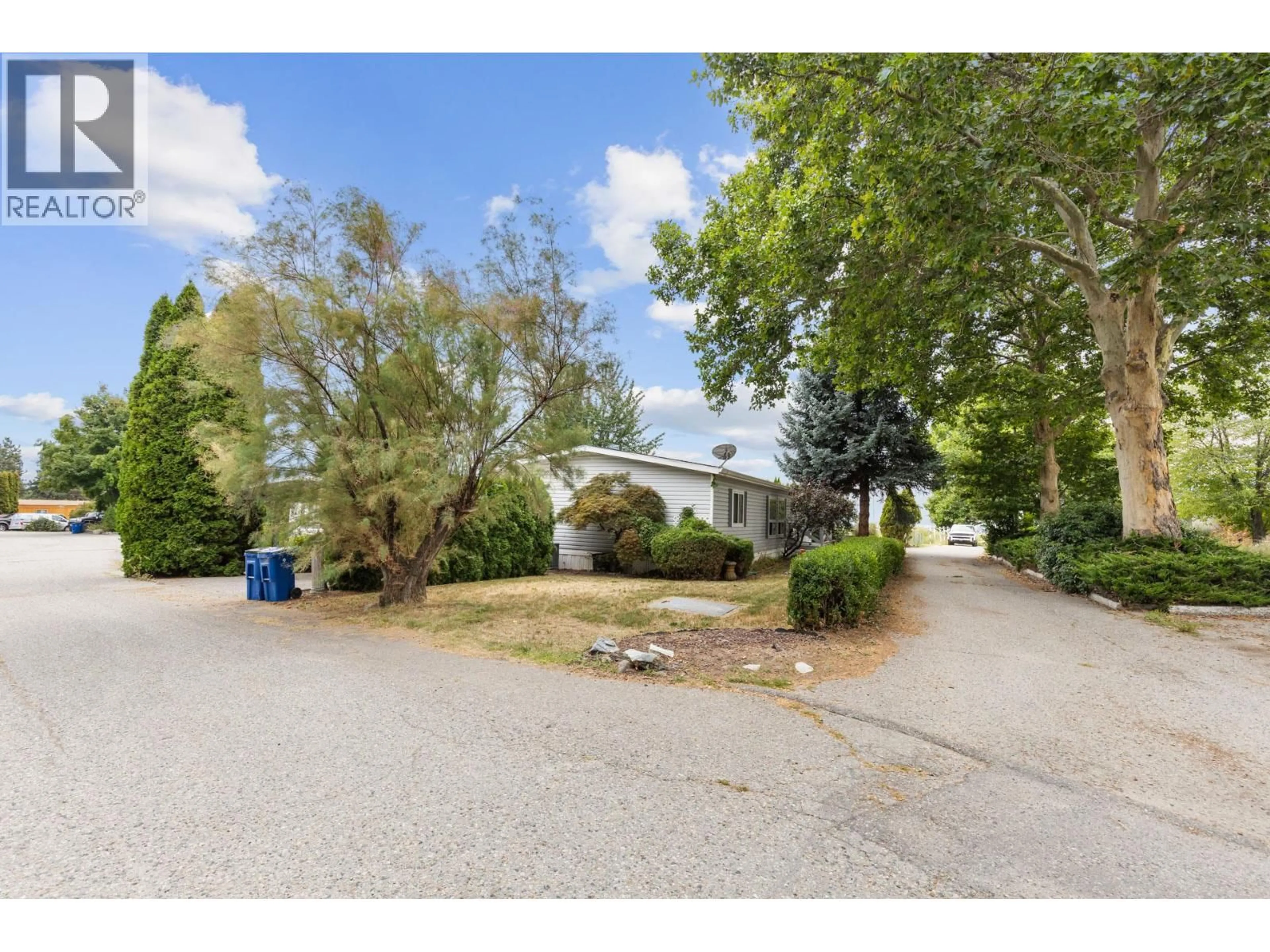 A pic from outside/outdoor area/front of a property/back of a property/a pic from drone, street for 214 - 2001 HIGHWAY 97 OTHER SOUTH, West Kelowna British Columbia V1Z3M8