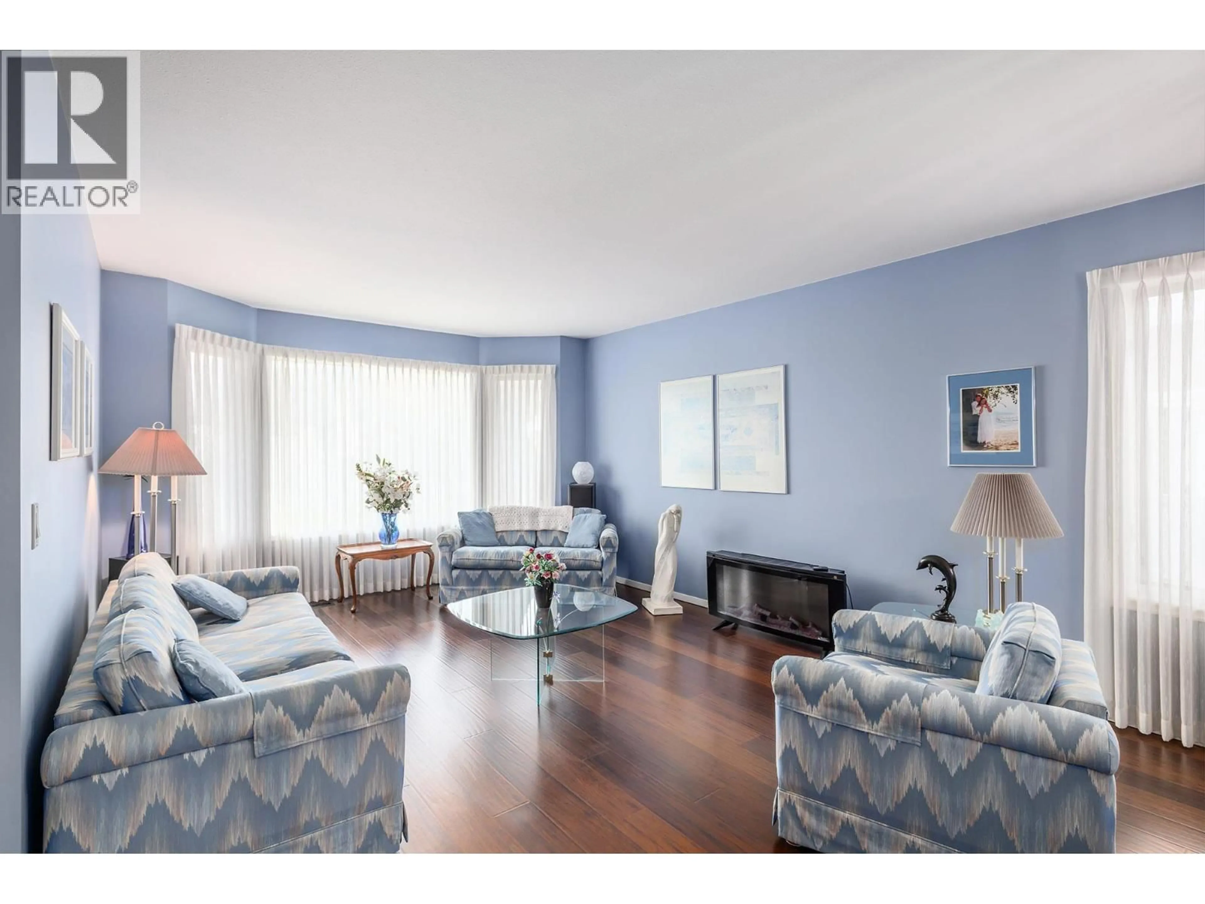 Living room with furniture, wood/laminate floor for 1693 NEWPORT ROAD, West Kelowna British Columbia V4T1X1