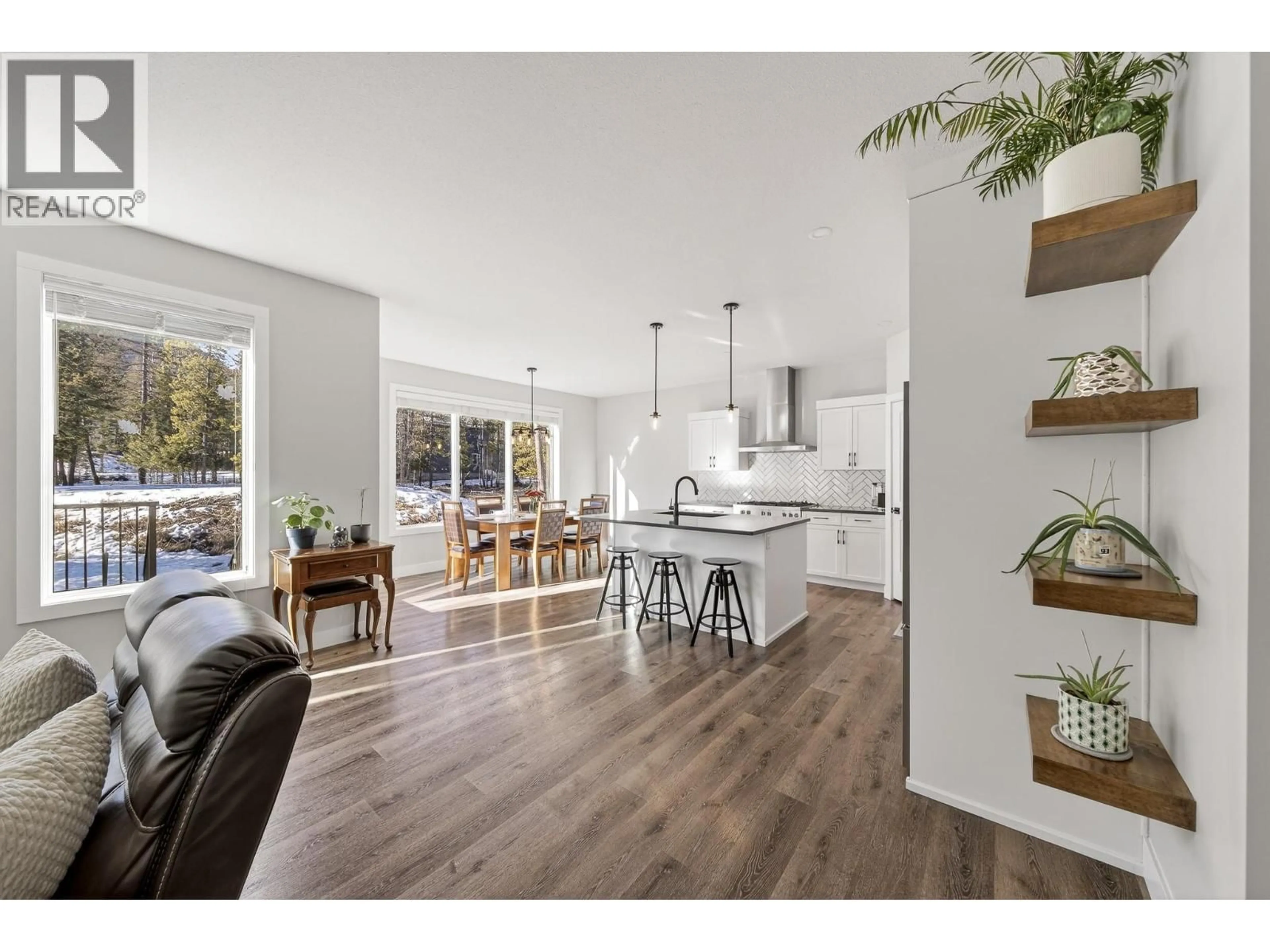 Open concept kitchen, wood/laminate floor for 2071 GOLDEN EAGLE DRIVE, Sparwood British Columbia V0B2G2