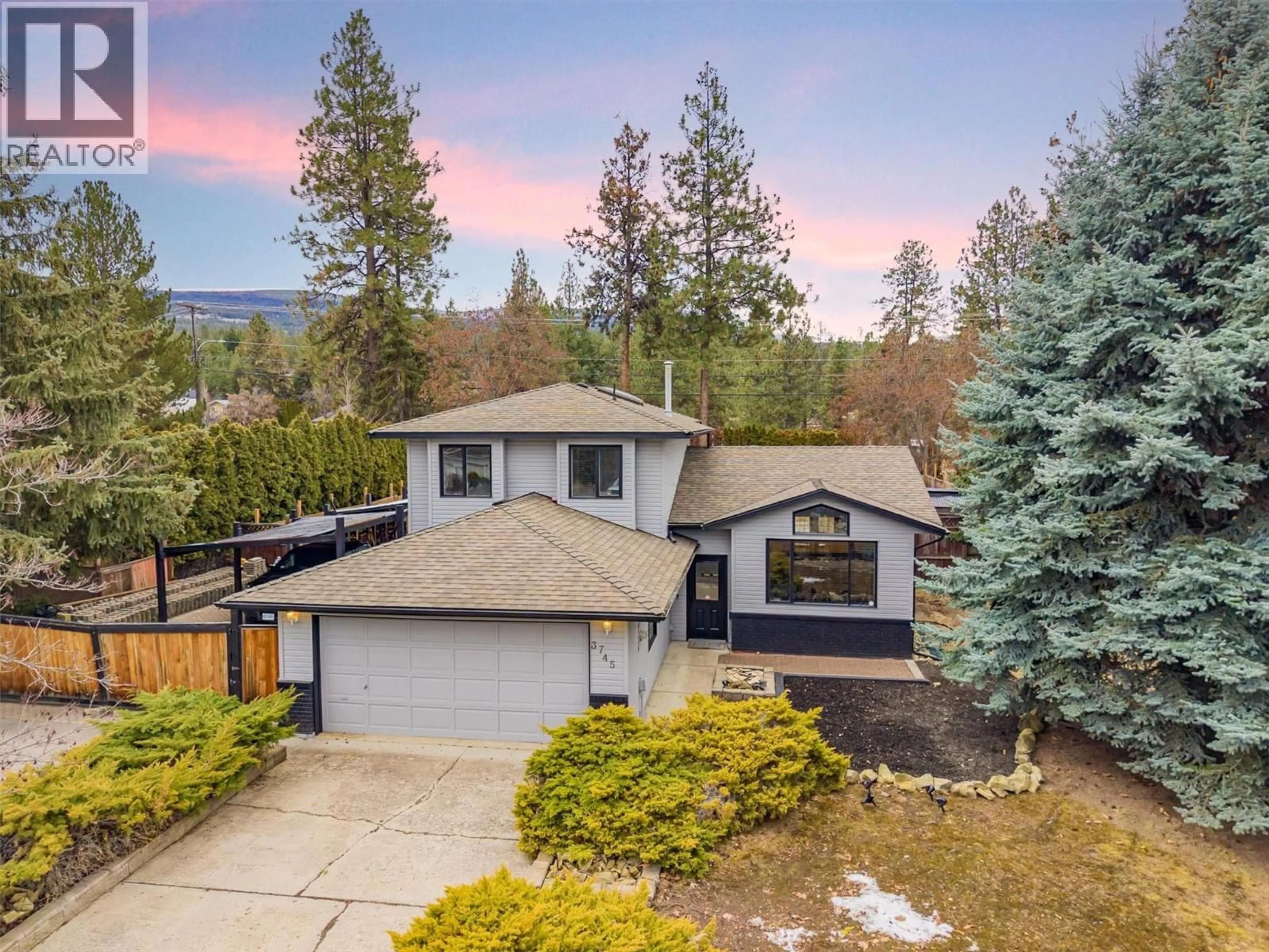 A pic from outside/outdoor area/front of a property/back of a property/a pic from drone, mountain view for 3745 KIMATOUCHE ROAD, Kelowna British Columbia V1Y7R2