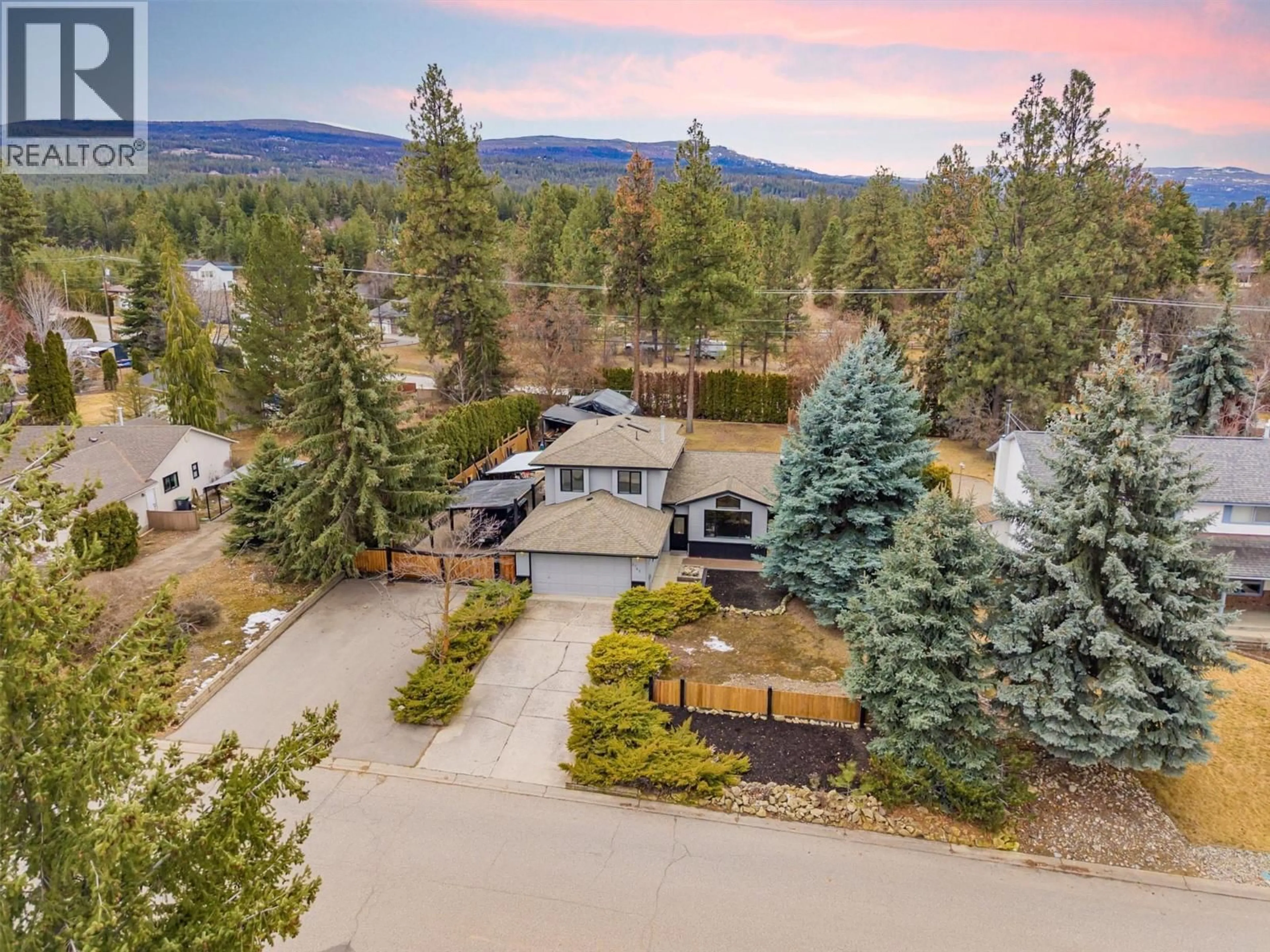 A pic from outside/outdoor area/front of a property/back of a property/a pic from drone, mountain view for 3745 KIMATOUCHE ROAD, Kelowna British Columbia V1Y7R2