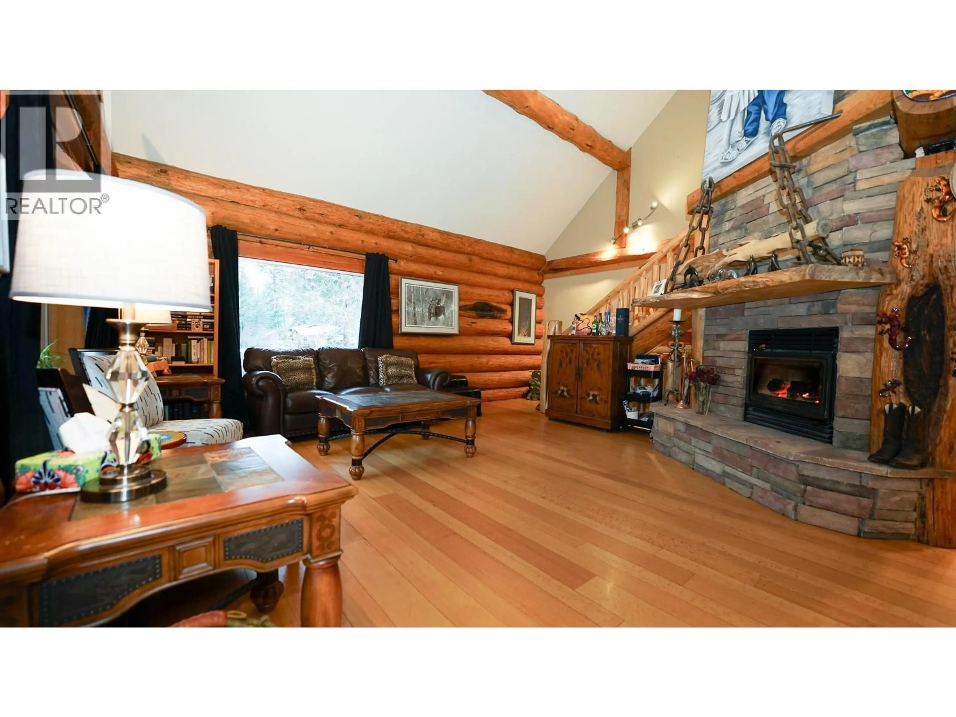 Living room with furniture, wood/laminate floor for 5464 AGATE BAY ROAD, Barriere British Columbia V0E2E0