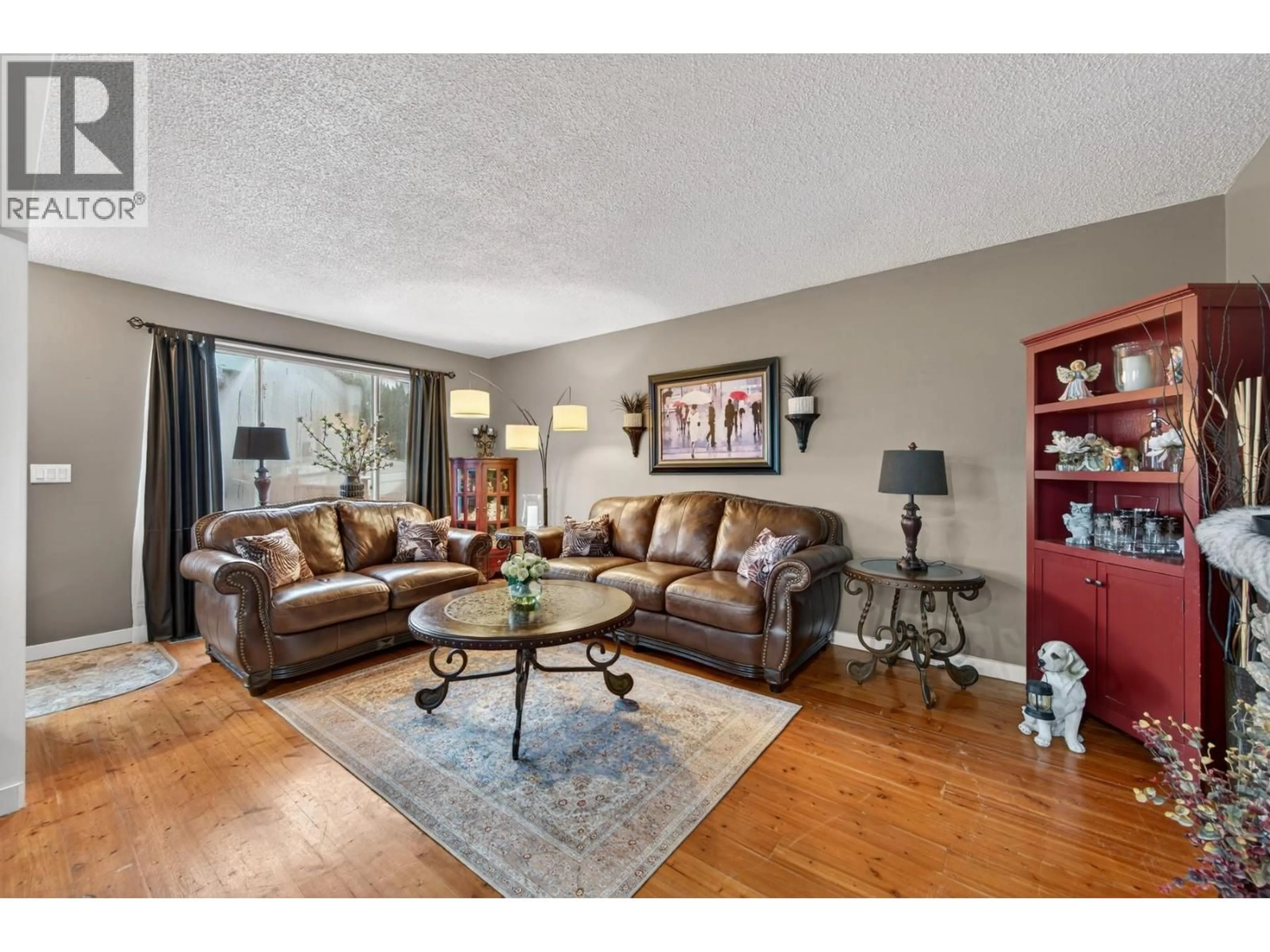 Living room with furniture, wood/laminate floor for 392 WADDINGTON DRIVE, Kamloops British Columbia V2E1M5
