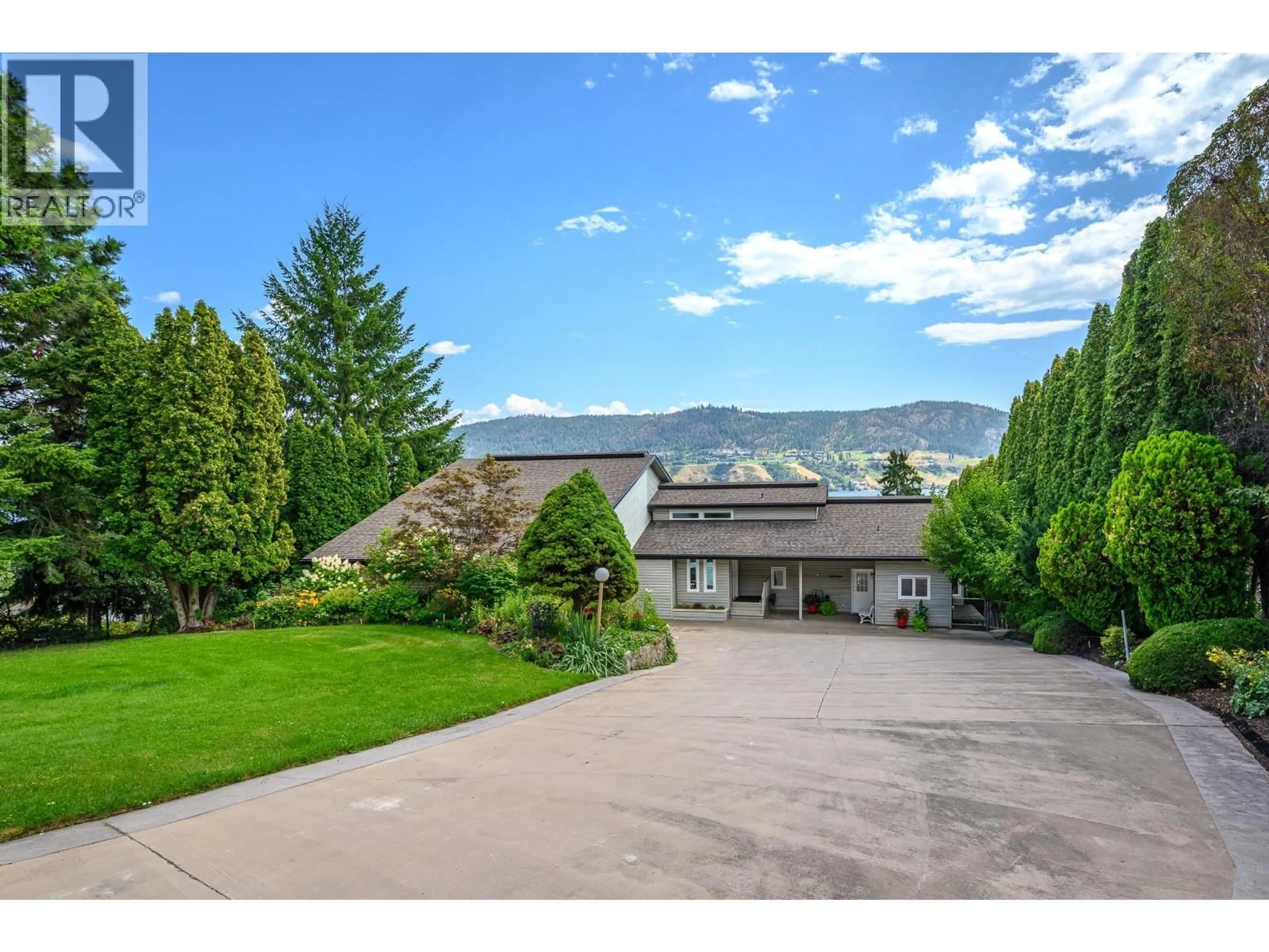 A pic from outside/outdoor area/front of a property/back of a property/a pic from drone, mountain view for 7994 TRONSON ROAD, Vernon British Columbia V1H1C6
