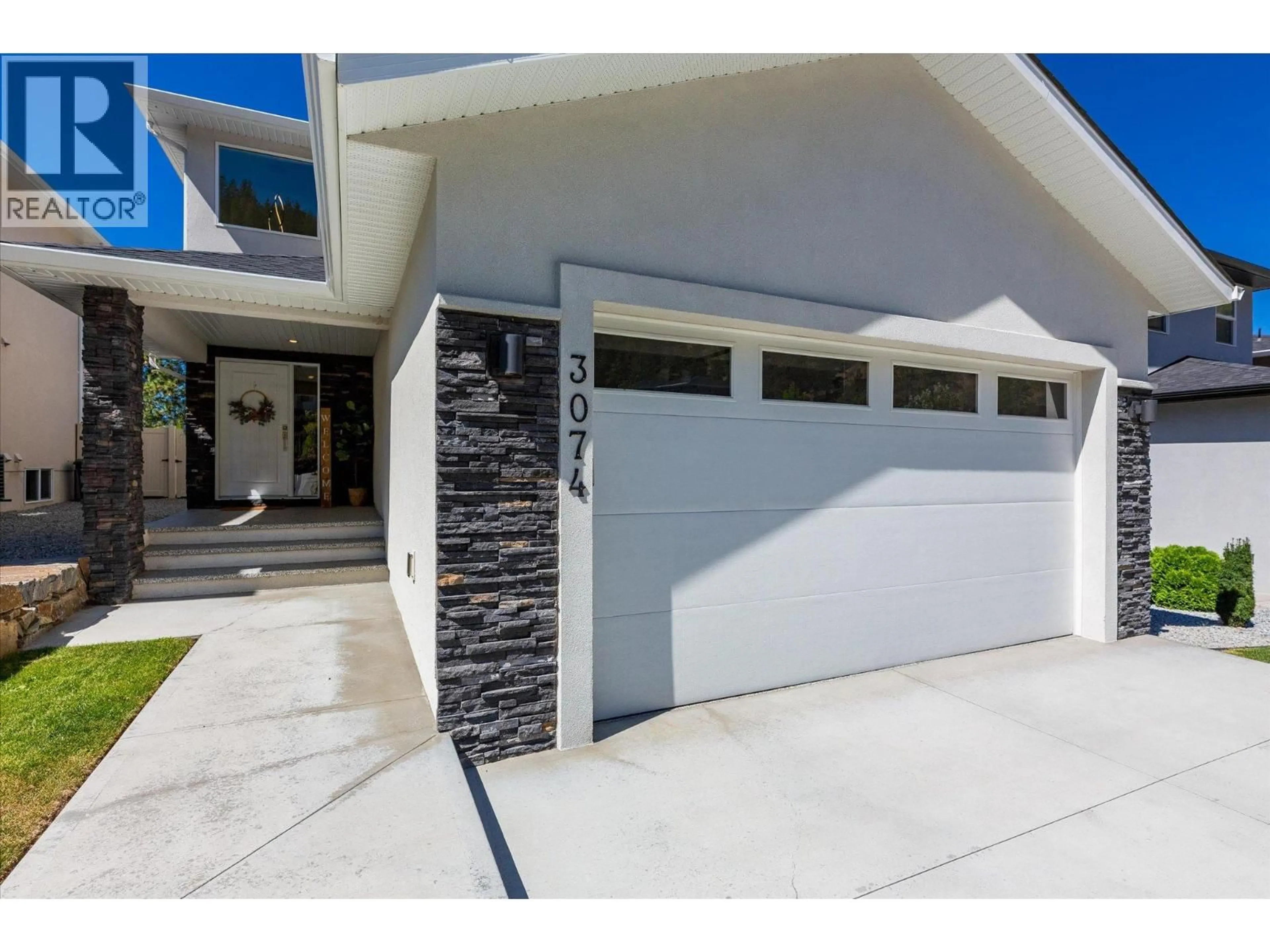 Home with vinyl exterior material, street for 3074 RIESLING WAY, West Kelowna British Columbia V4T0A5