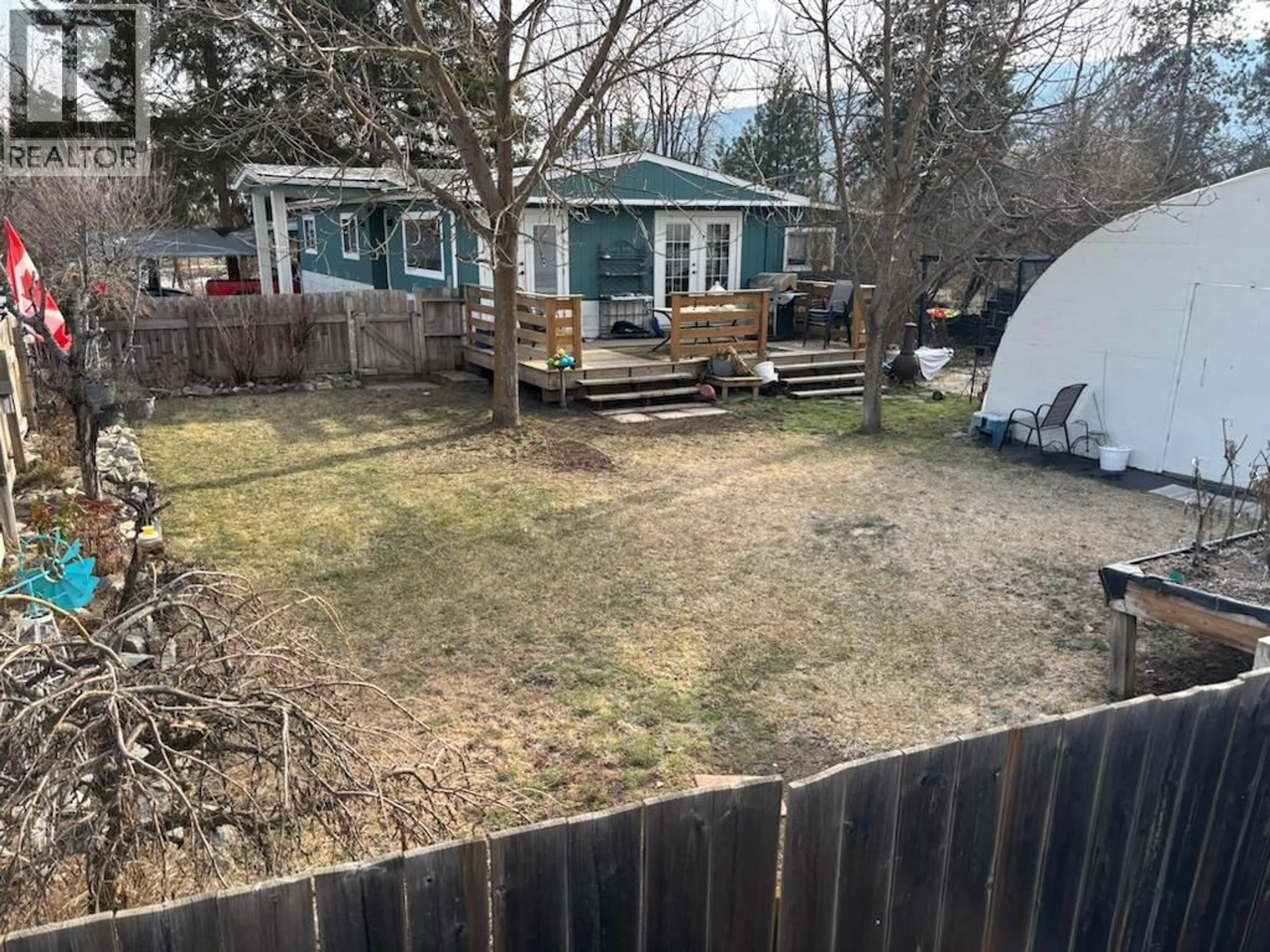 A pic from outside/outdoor area/front of a property/back of a property/a pic from drone, street for 1332 66TH STREET, Grand Forks British Columbia V0H1H0