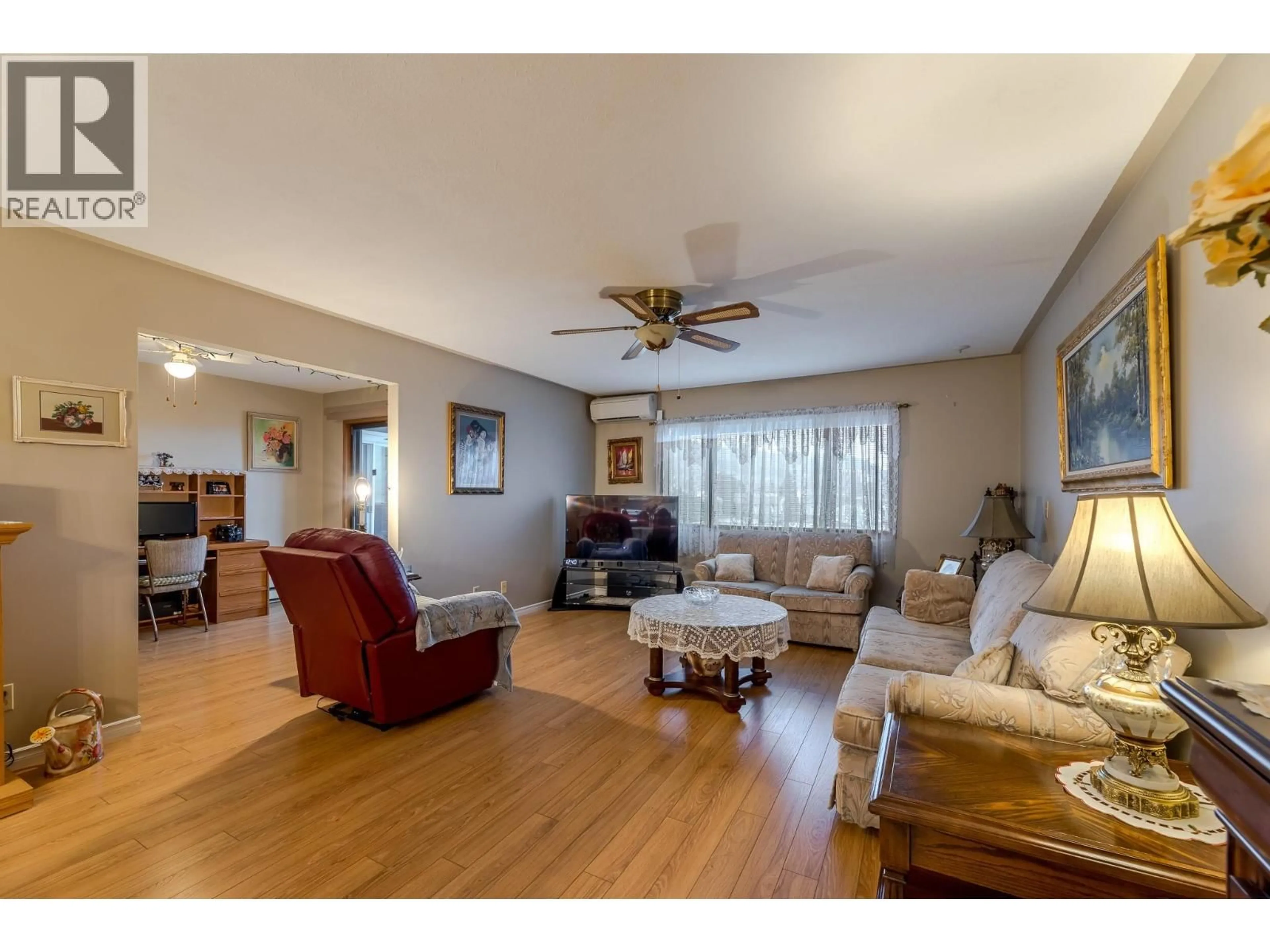 Living room with furniture, wood/laminate floor for 307 - 1820 ATKINSON STREET, Penticton British Columbia V2A7M6