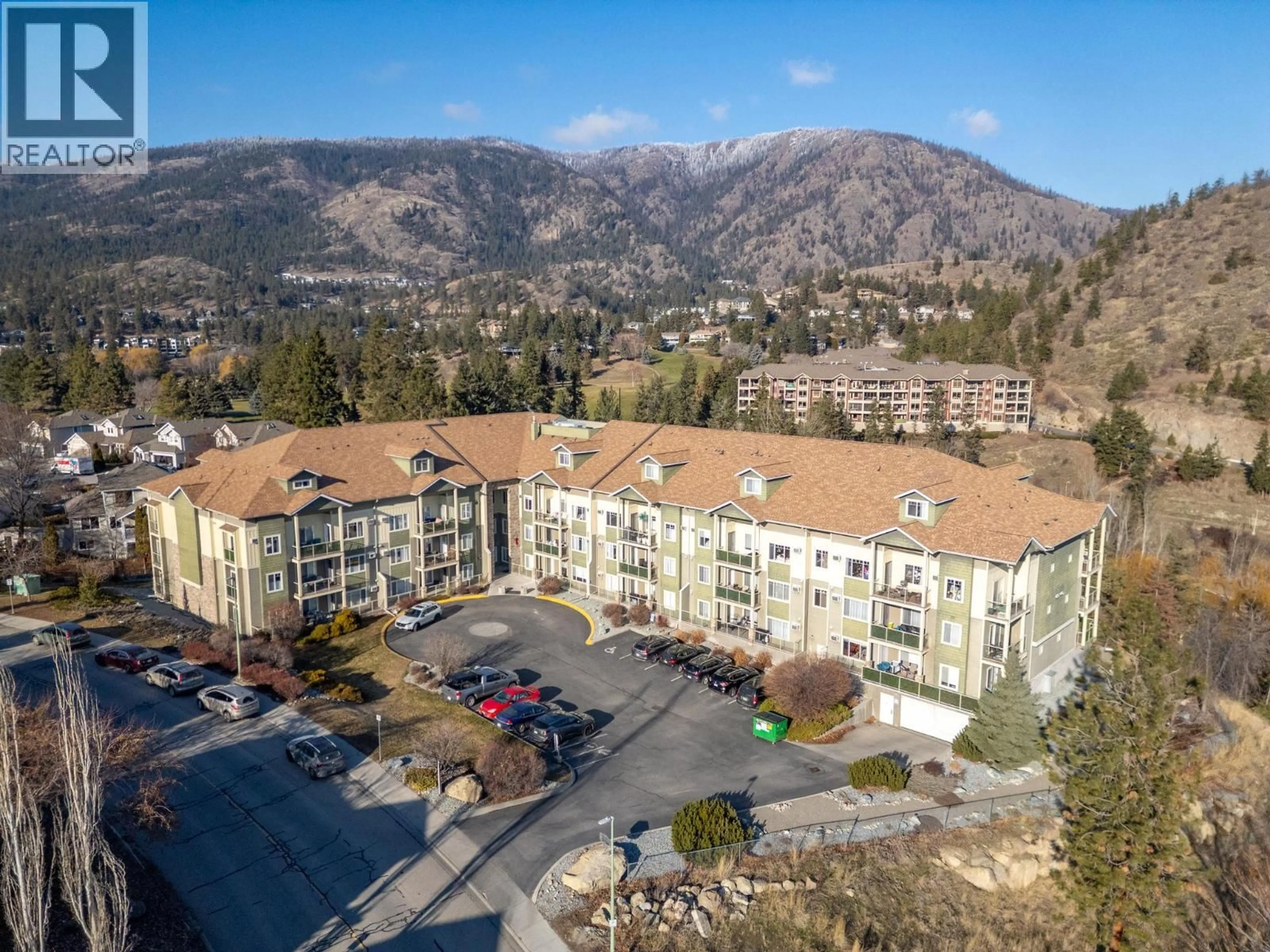 A pic from outside/outdoor area/front of a property/back of a property/a pic from drone, mountain view for 105 - 2120 SHANNON RIDGE DRIVE, West Kelowna British Columbia V4T2Z3
