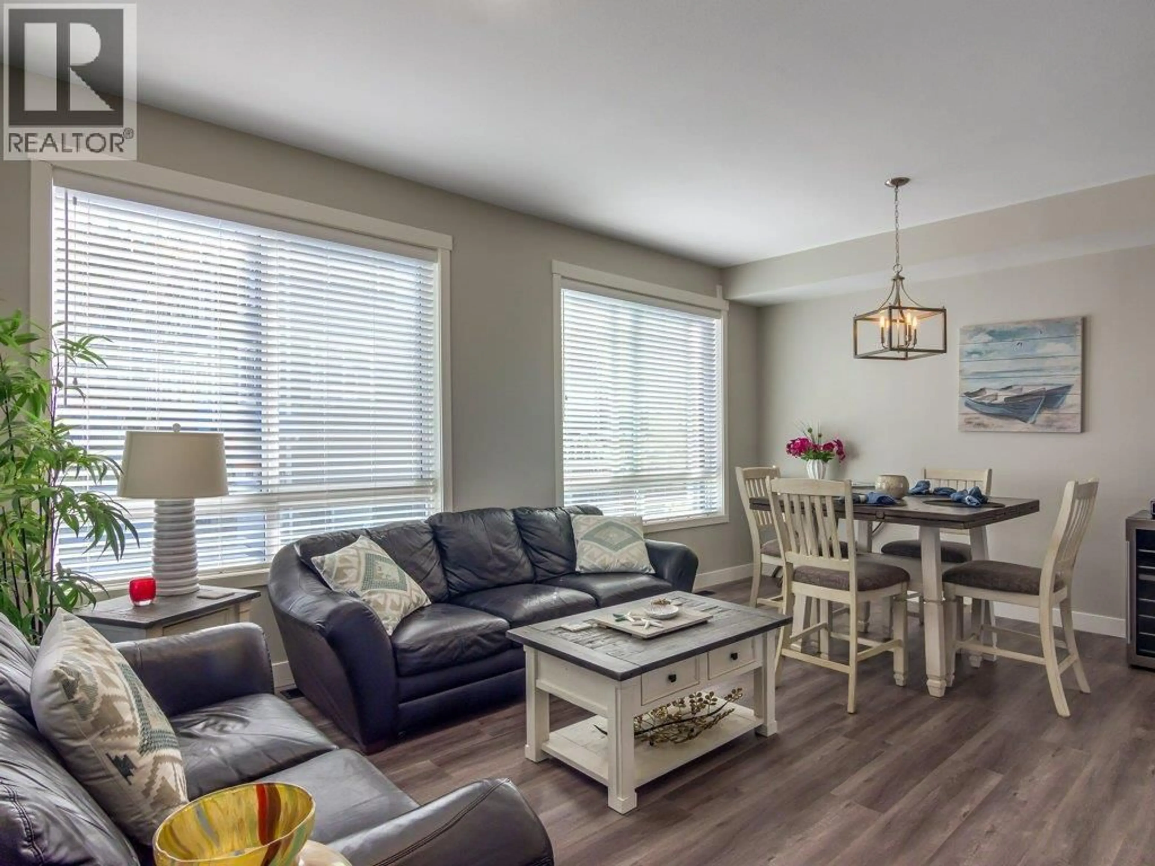 Living room with furniture, wood/laminate floor for 116 - 1115 HOLDEN ROAD, Penticton British Columbia V2A0B7