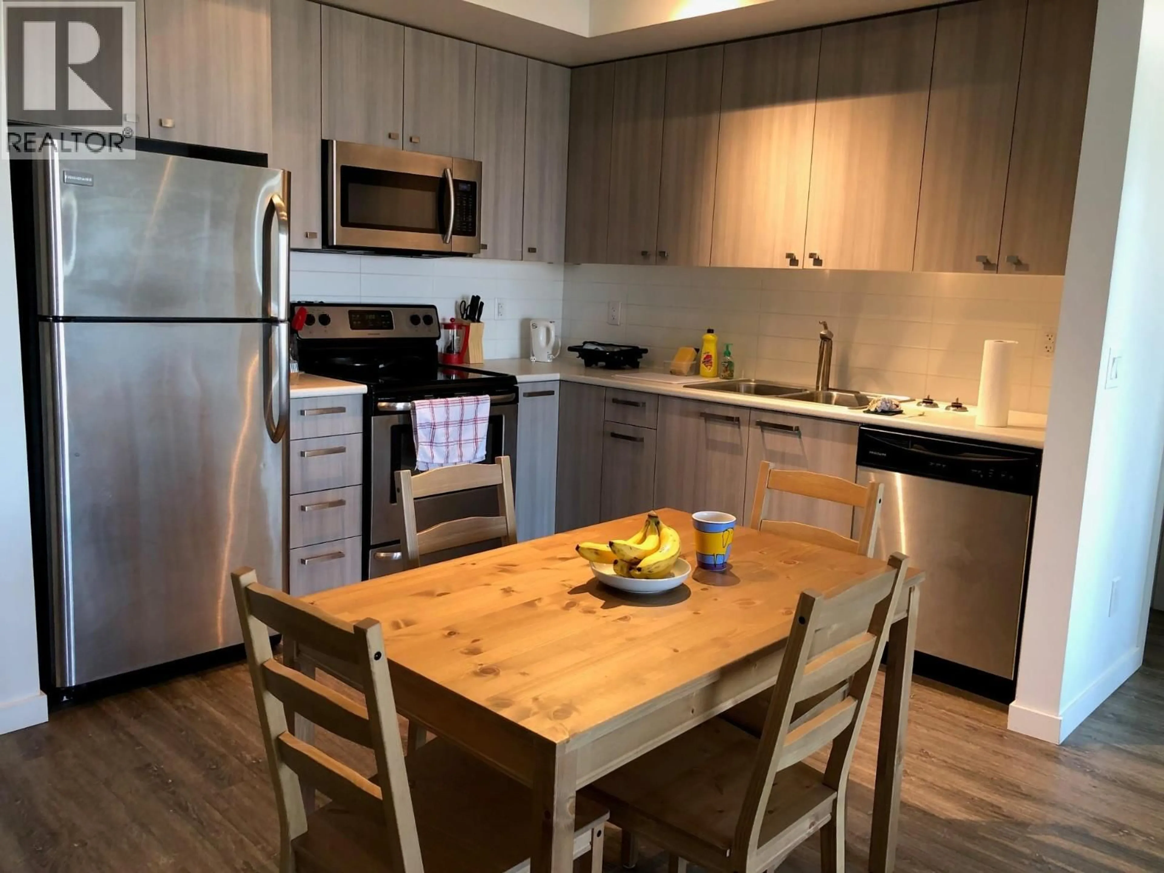 Standard kitchen, wood/laminate floor for 303 - 935 ACADEMY WAY, Kelowna British Columbia V1V3C9