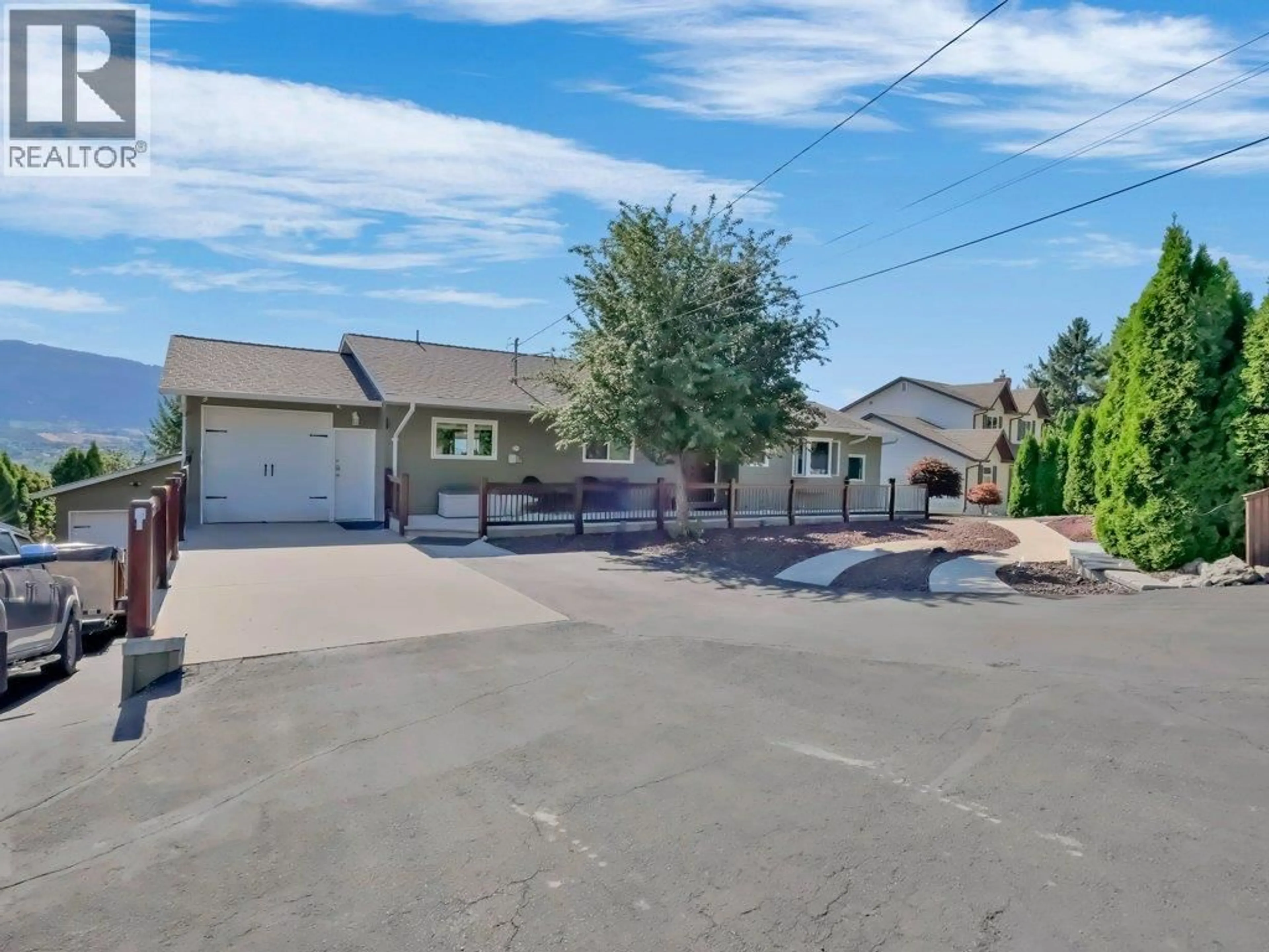 A pic from outside/outdoor area/front of a property/back of a property/a pic from drone, street for 6475 BLUE JAY ROAD, Vernon British Columbia V1H1W5