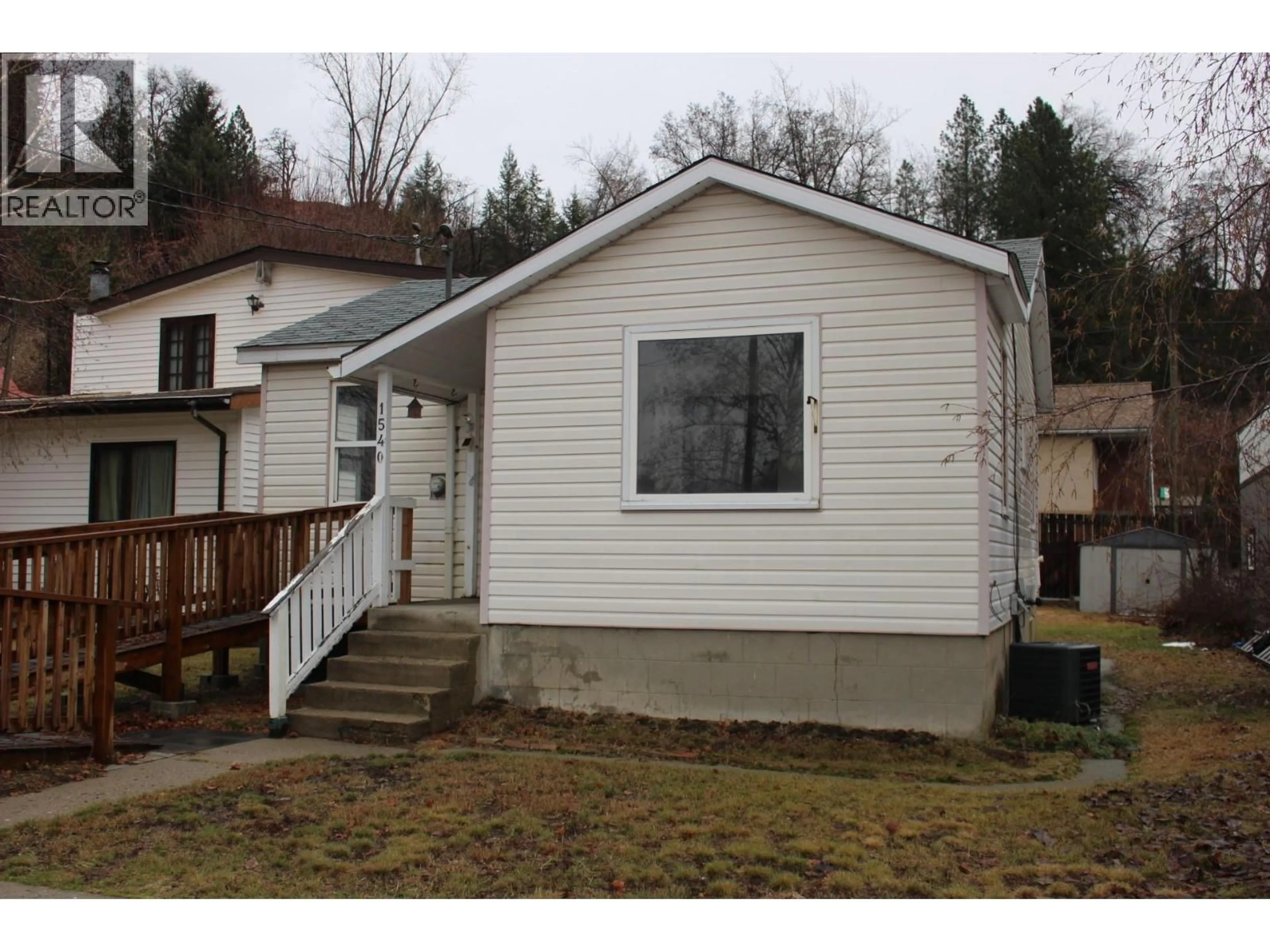 Home with vinyl exterior material, street for 1540 MCBETH STREET, Trail British Columbia V1R1Z4