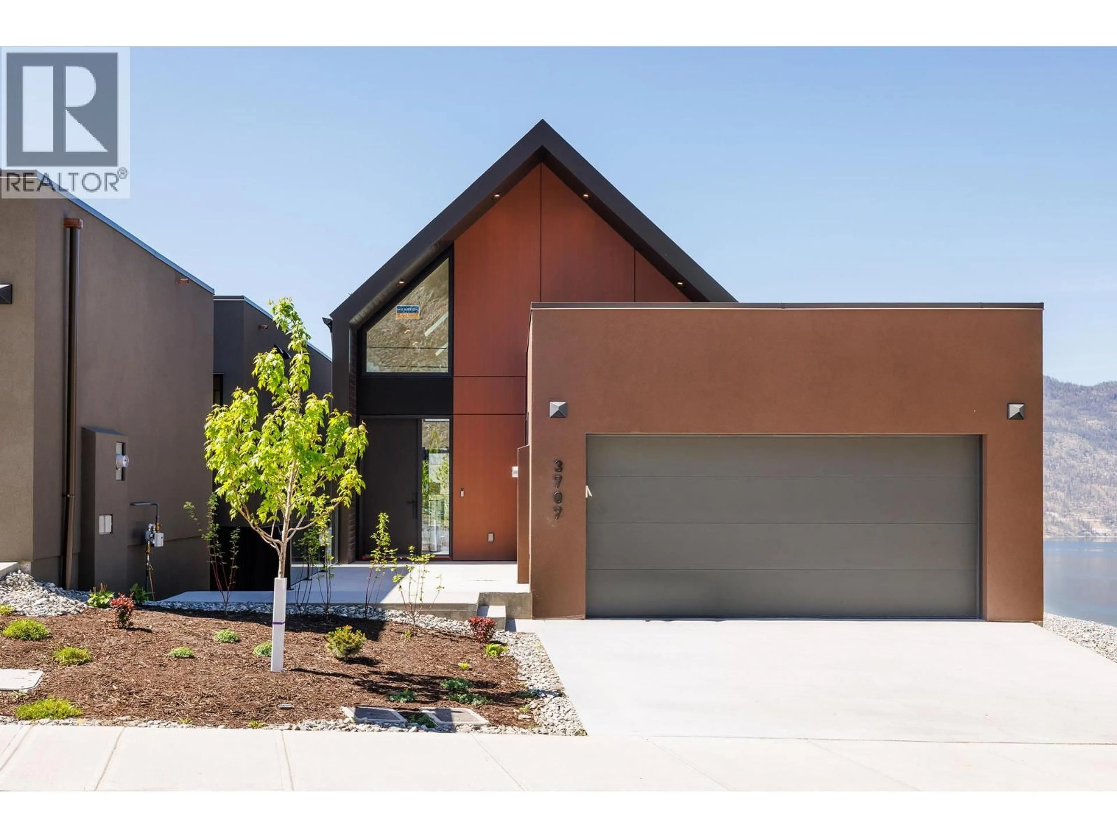 Home with brick exterior material, street for 3707 MCKINLEY BEACH DRIVE, Kelowna British Columbia V1V1G2